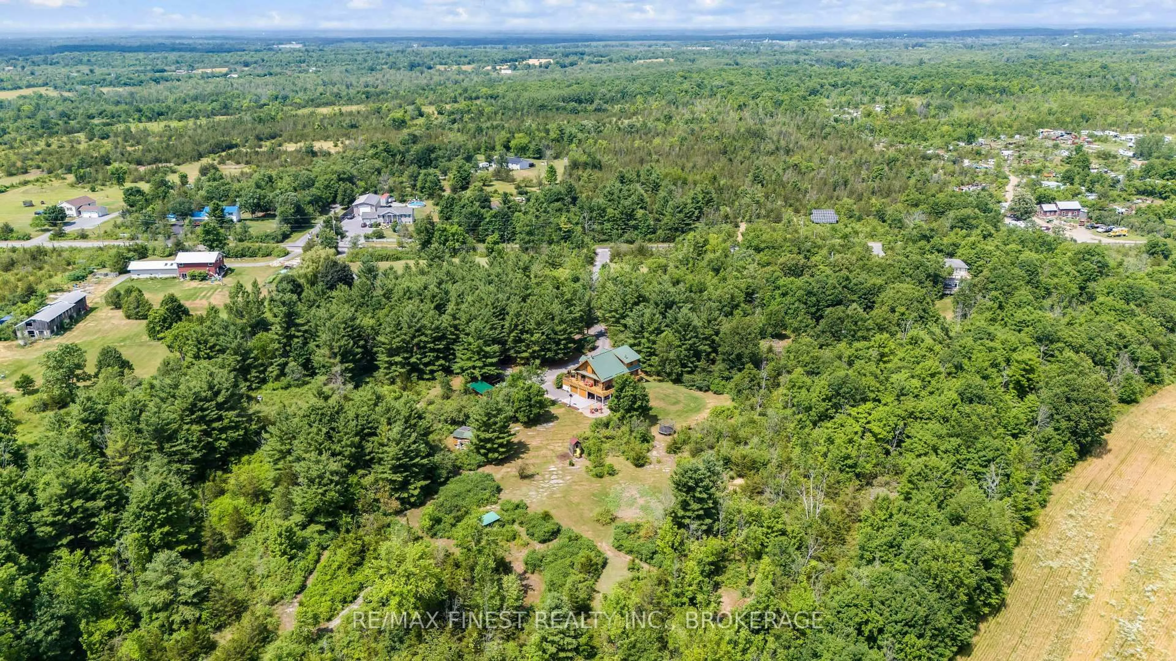 A pic from outside/outdoor area/front of a property/back of a property/a pic from drone, forest/trees view for 5006 Wallace Rd, Harrowsmith Ontario K0H 1V0