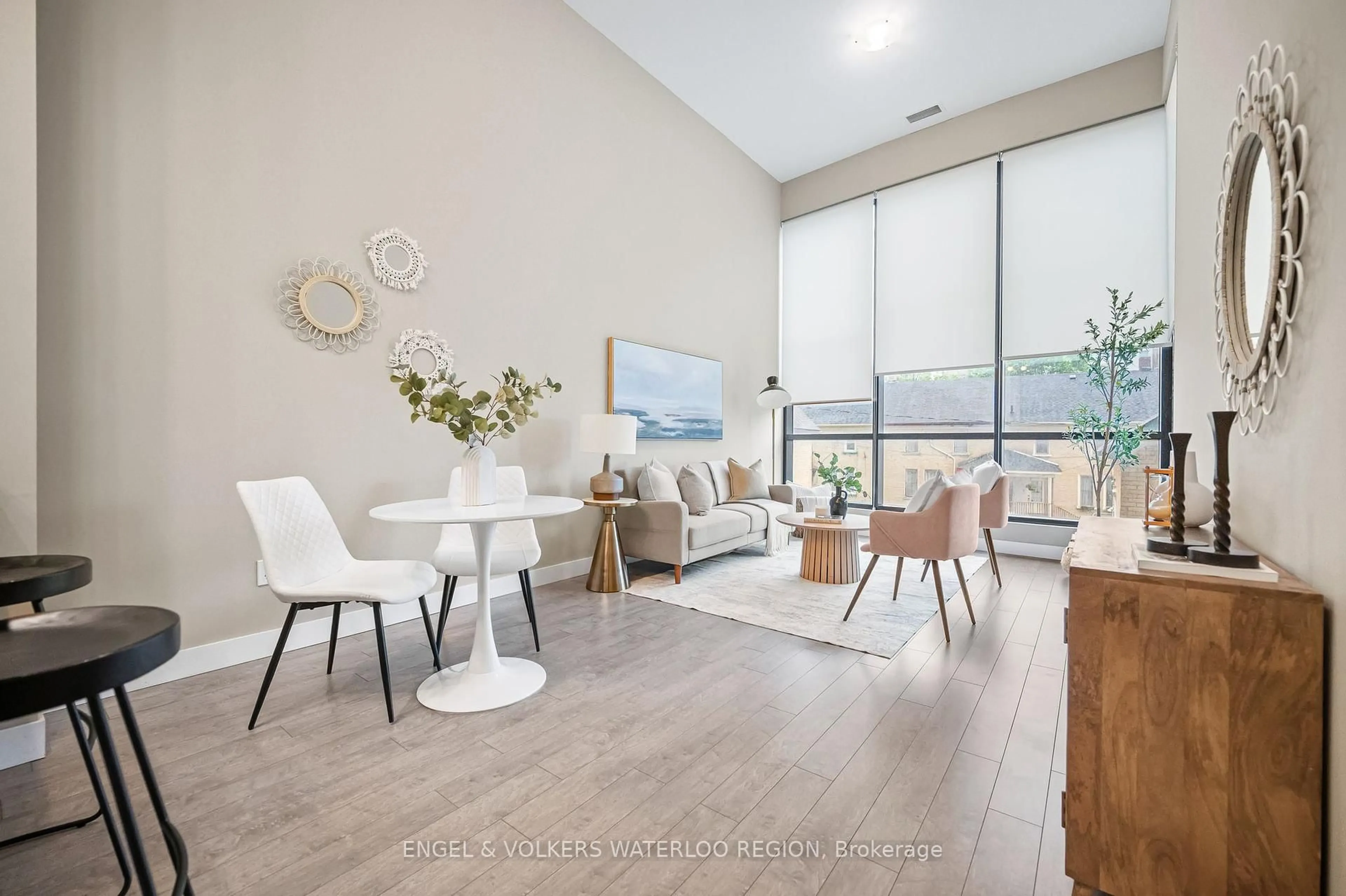 Living room with furniture, wood/laminate floor for 100 Garment St #210, Kitchener Ontario N2G 0C3