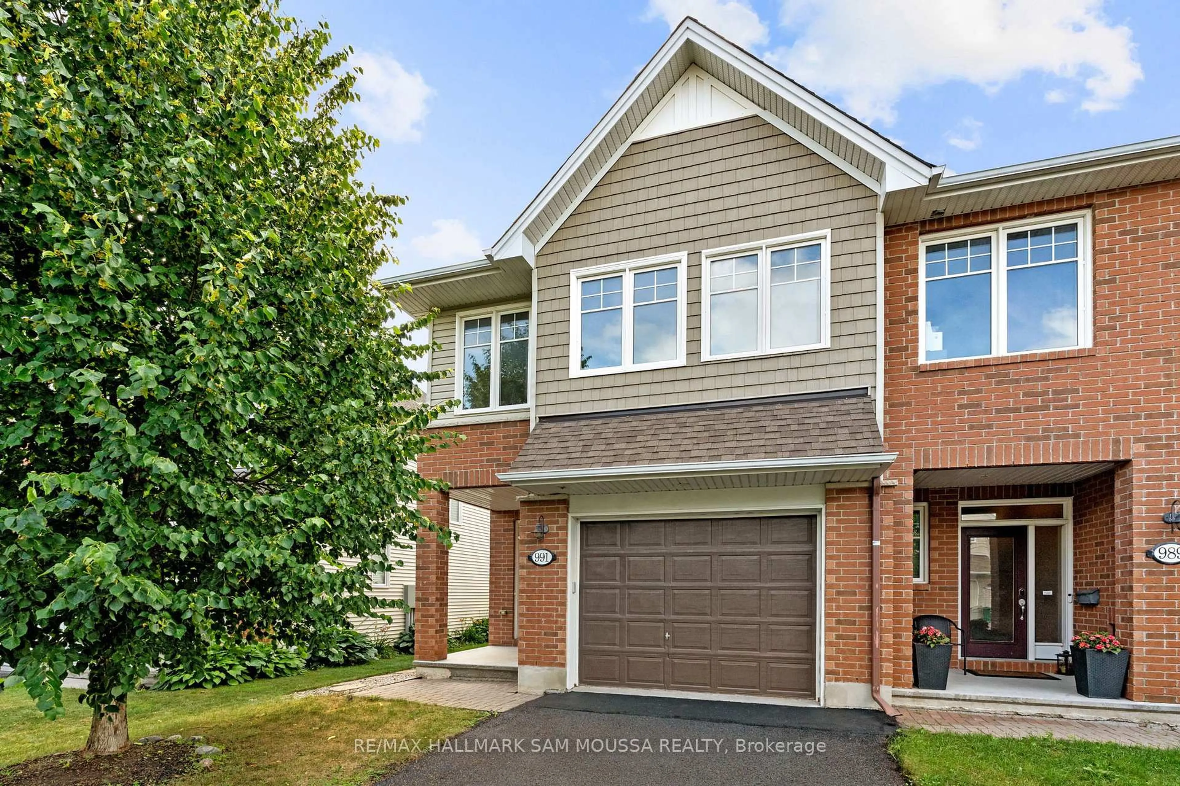 Home with brick exterior material, street for 991 Bunchberry Way, Ottawa Ontario K1T 0L6