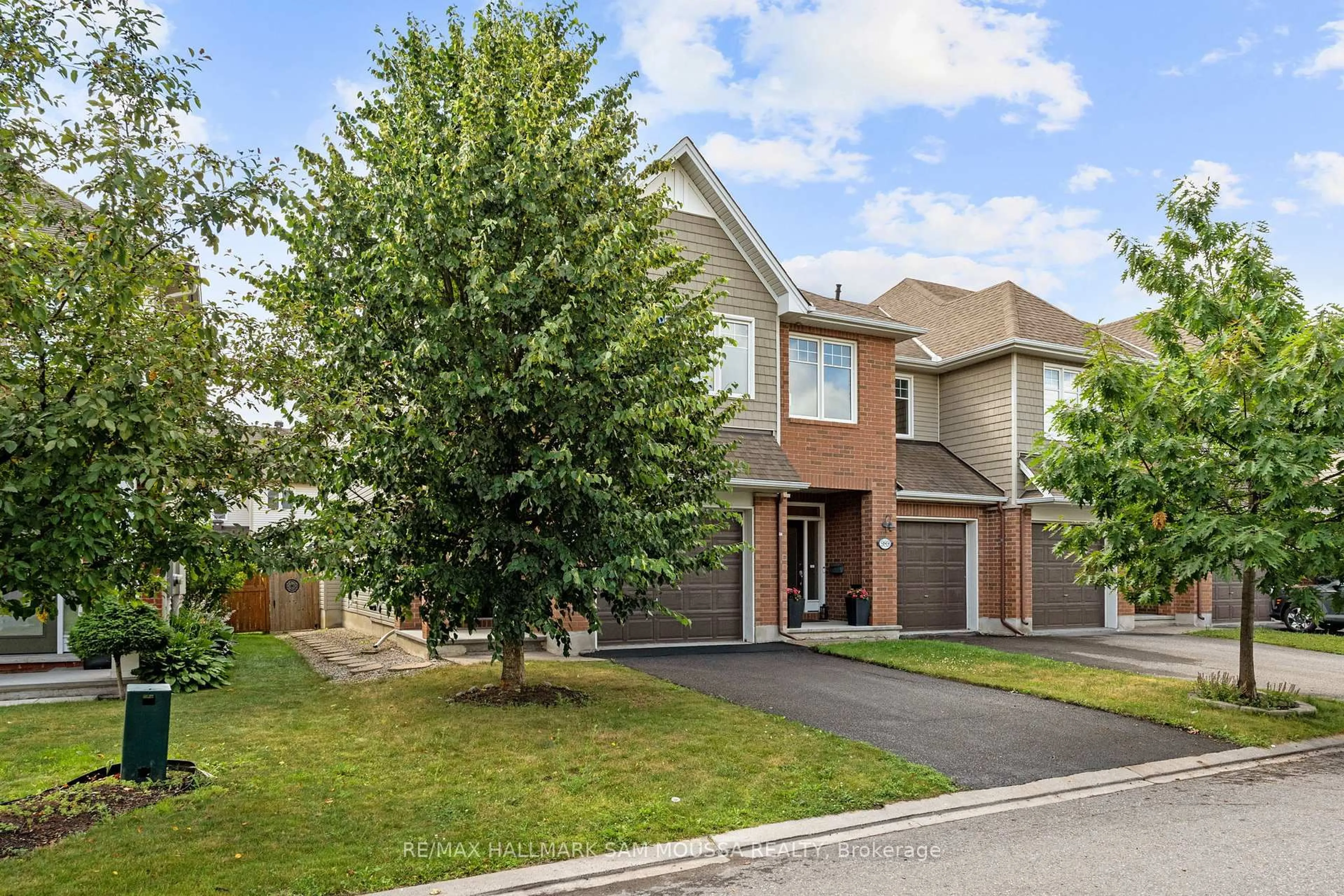 Home with brick exterior material, street for 991 Bunchberry Way, Ottawa Ontario K1T 0L6