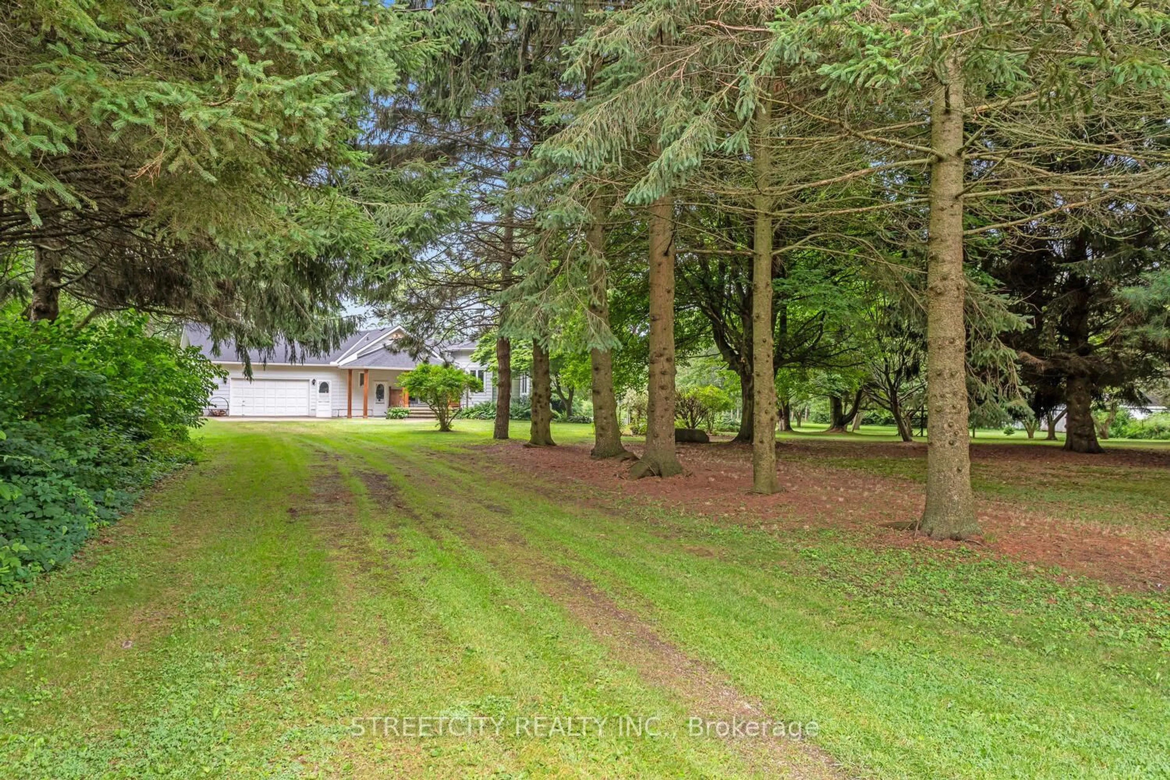 A pic from outside/outdoor area/front of a property/back of a property/a pic from drone, forest/trees view for 18725 Desmond Rd, Chatham-Kent Ontario N0P 2C0