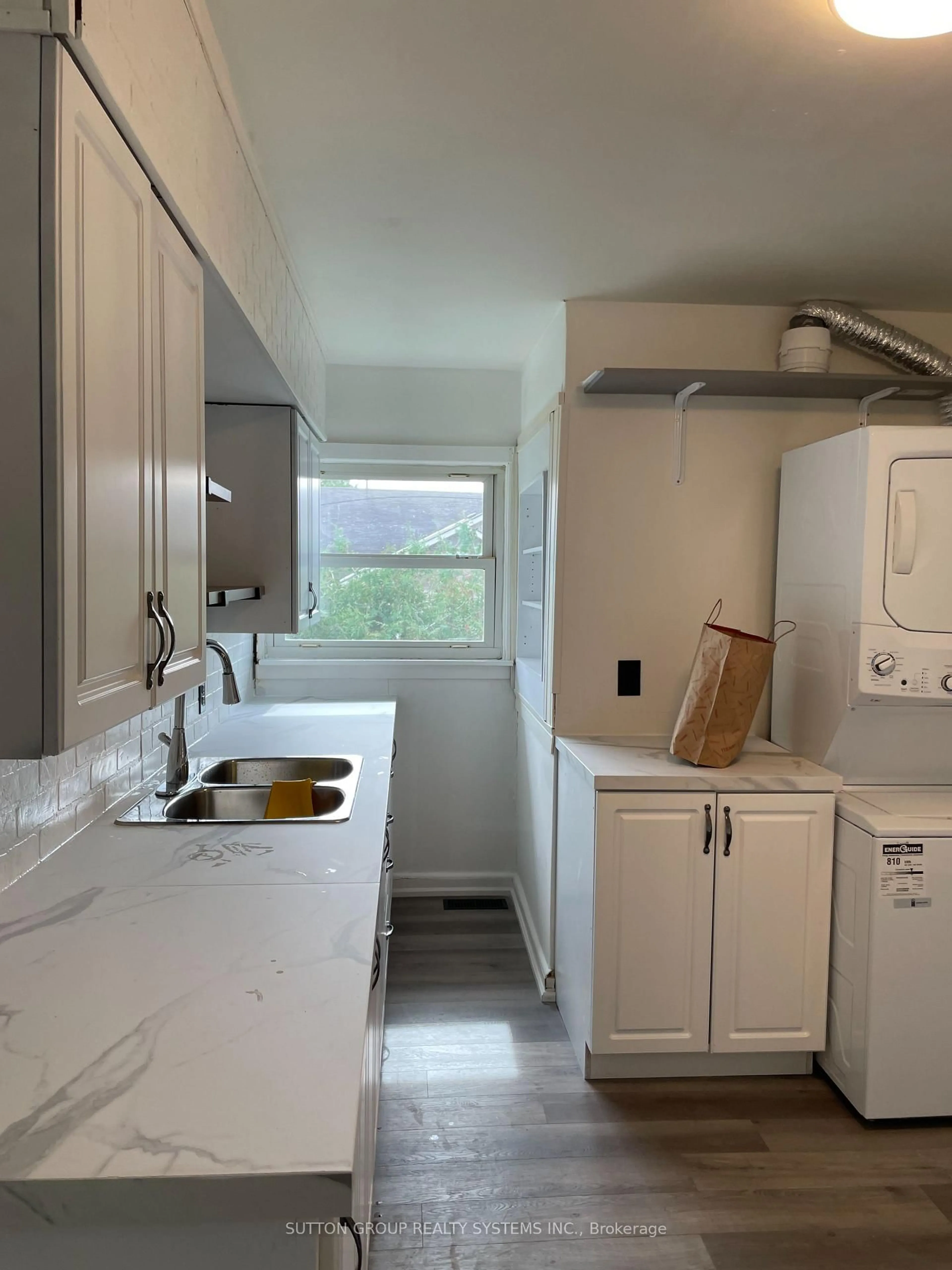 Kitchen with laundary machines, unknown for 30 Perry Ave, Brighton Ontario K0K 1H0