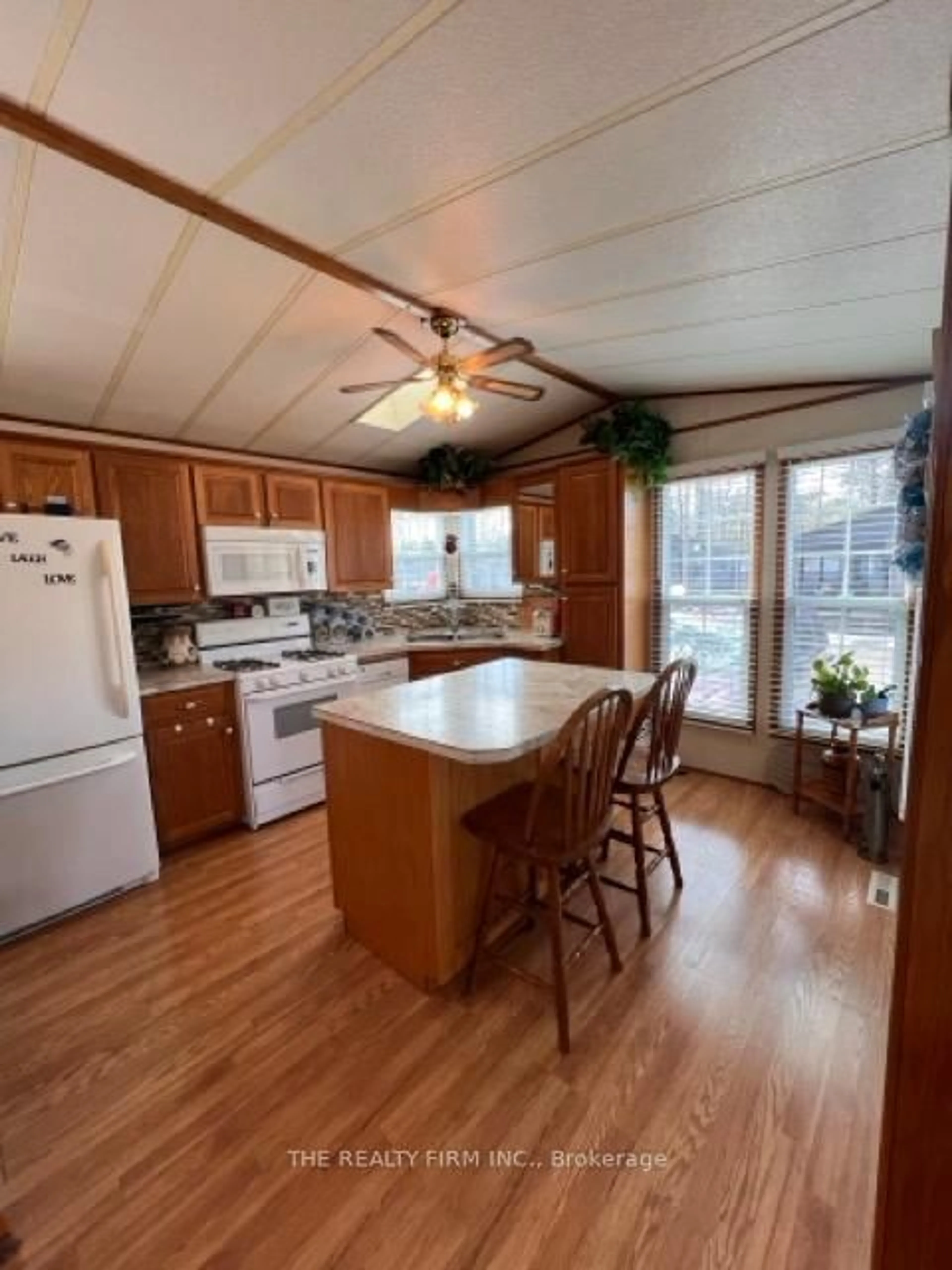 Open concept kitchen, wood/laminate floor for 77794 Orchard Line #F 51, Central Huron Ontario N0M 1G0
