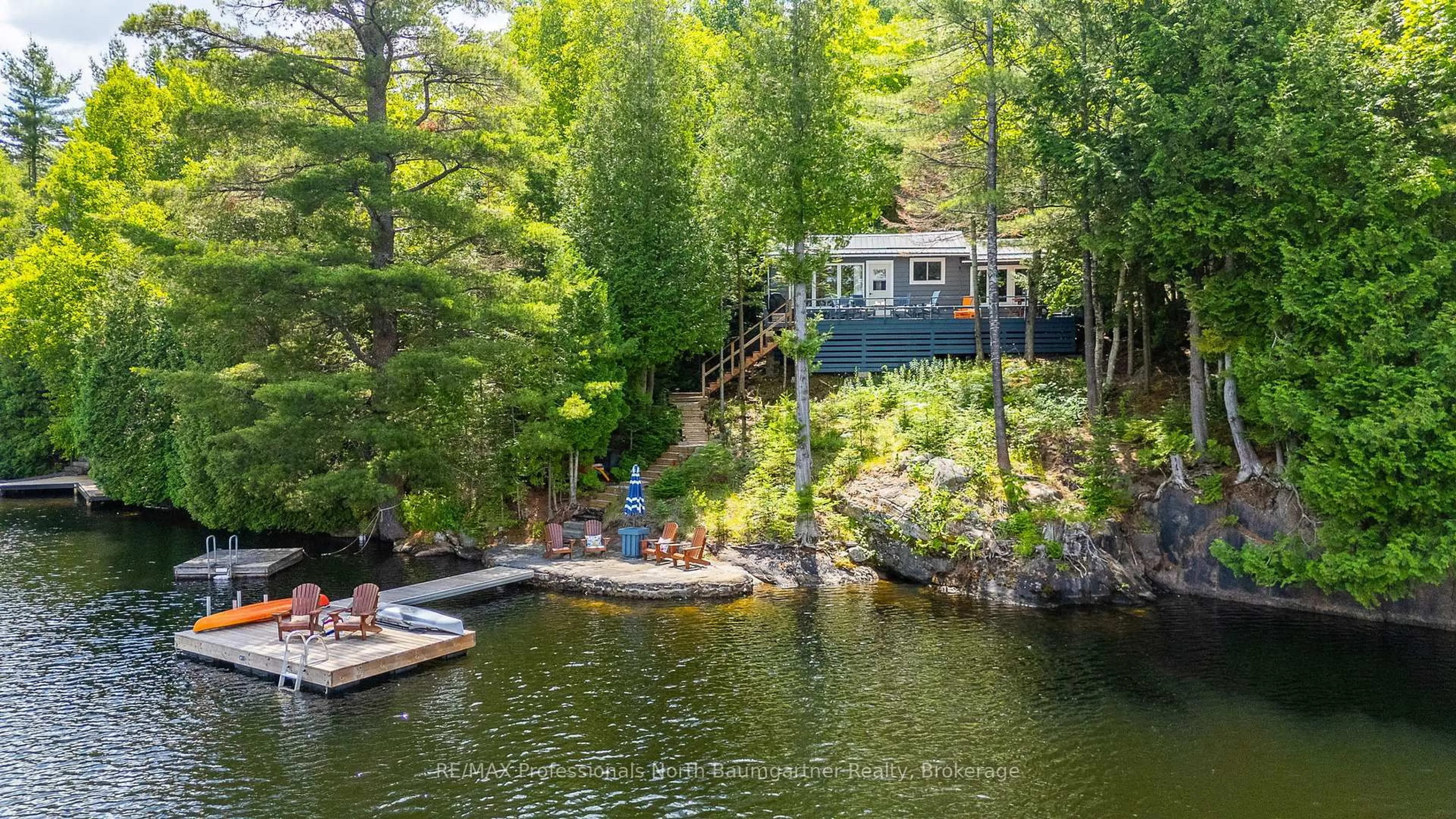 A pic from outside/outdoor area/front of a property/back of a property/a pic from drone, water/lake/river/ocean view for 1068 Wolverine Dr, Highlands East Ontario K0M 1S0