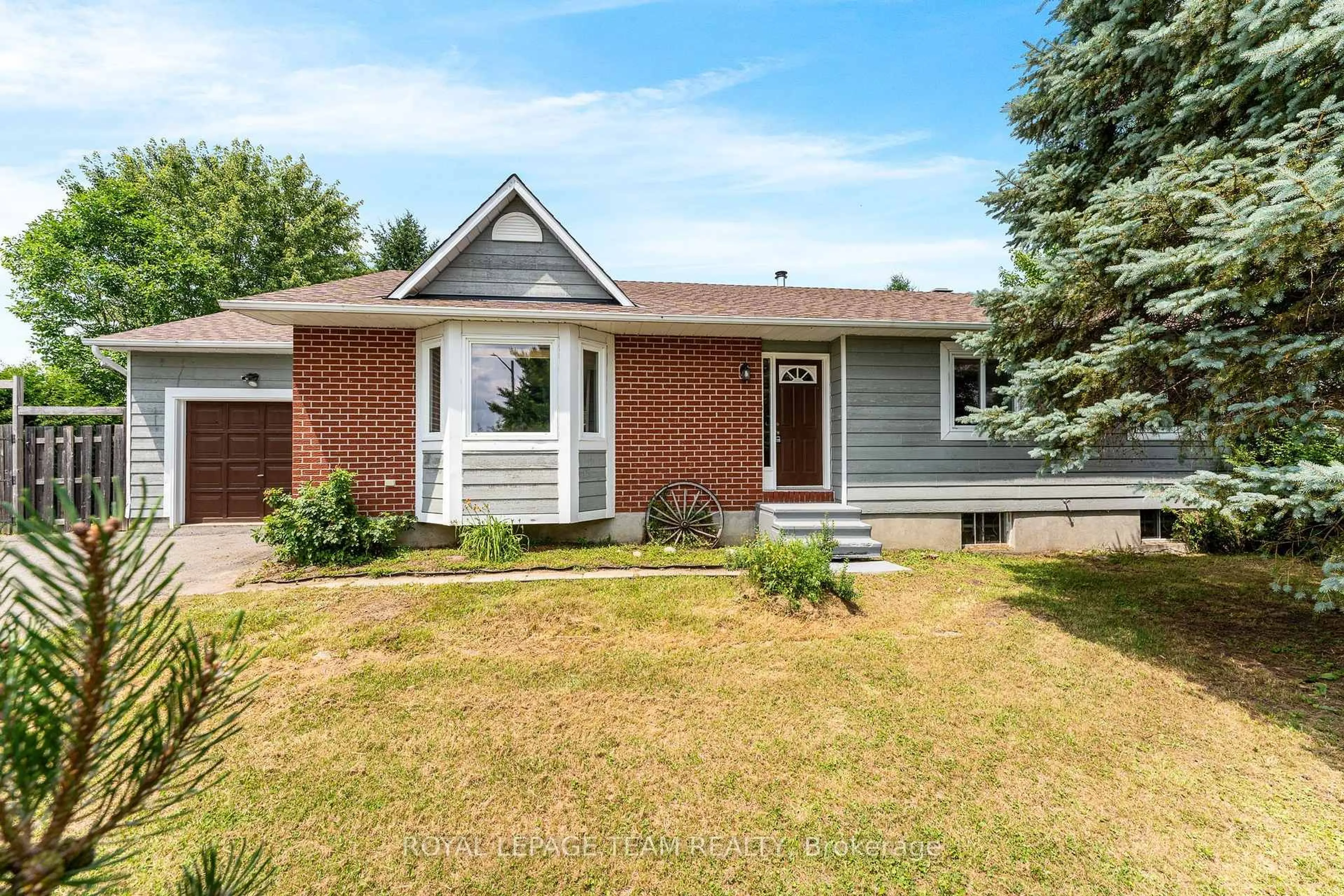 Home with brick exterior material, street for 106 Porcupine Tr, Ottawa Ontario K0A 1T0