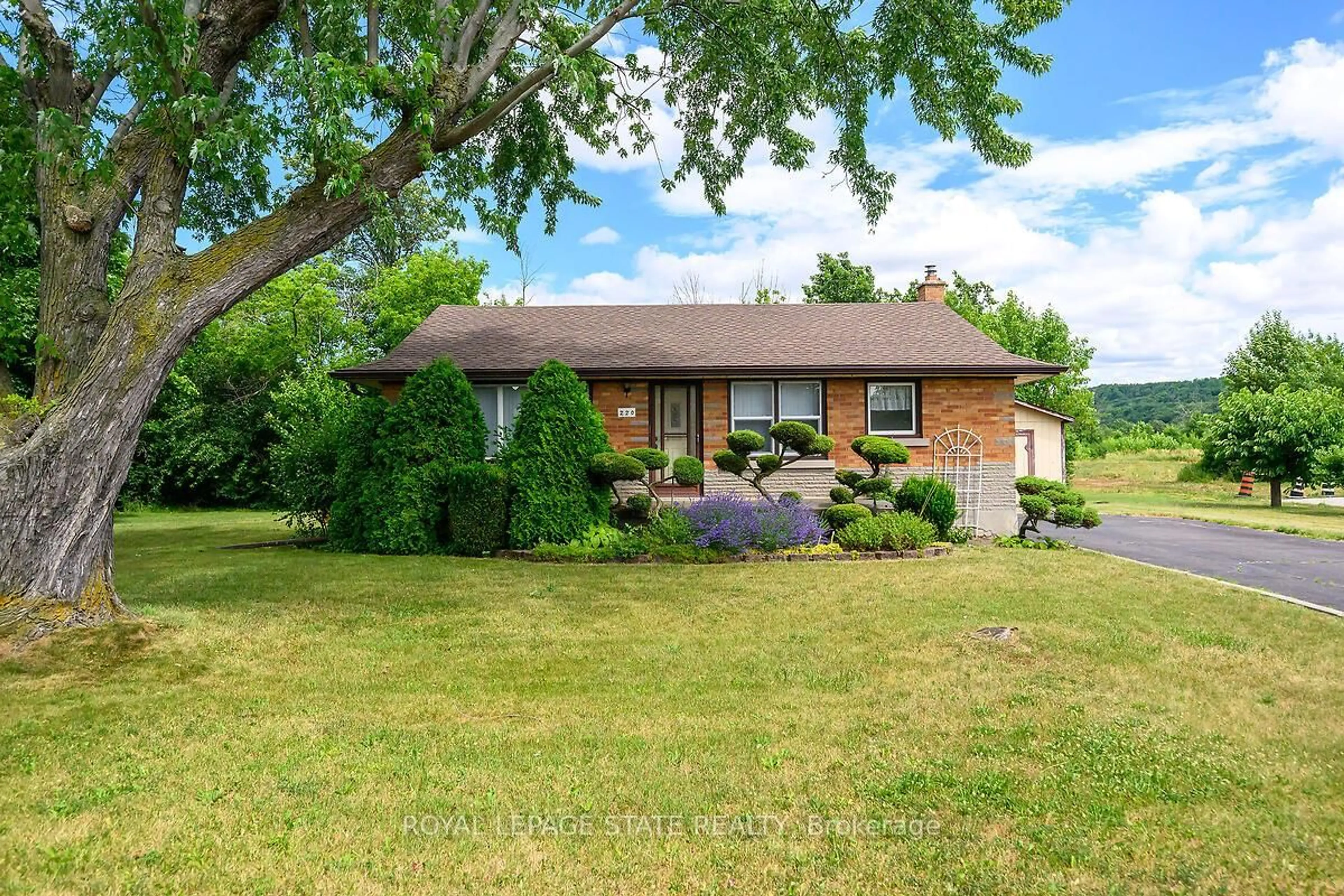Home with brick exterior material, street for 220 Winona Rd, Hamilton Ontario L8E 5K4