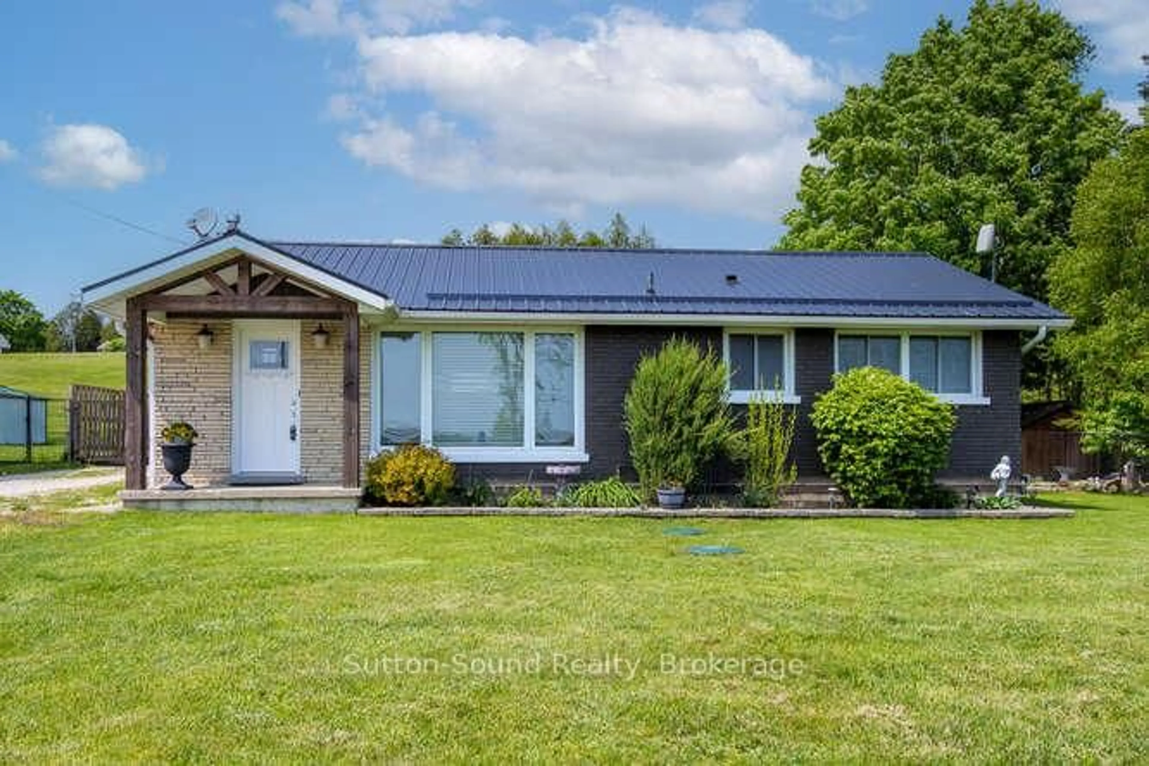 Home with vinyl exterior material, street for 202093 21 Highway, Georgian Bluffs Ontario N4K 5N7