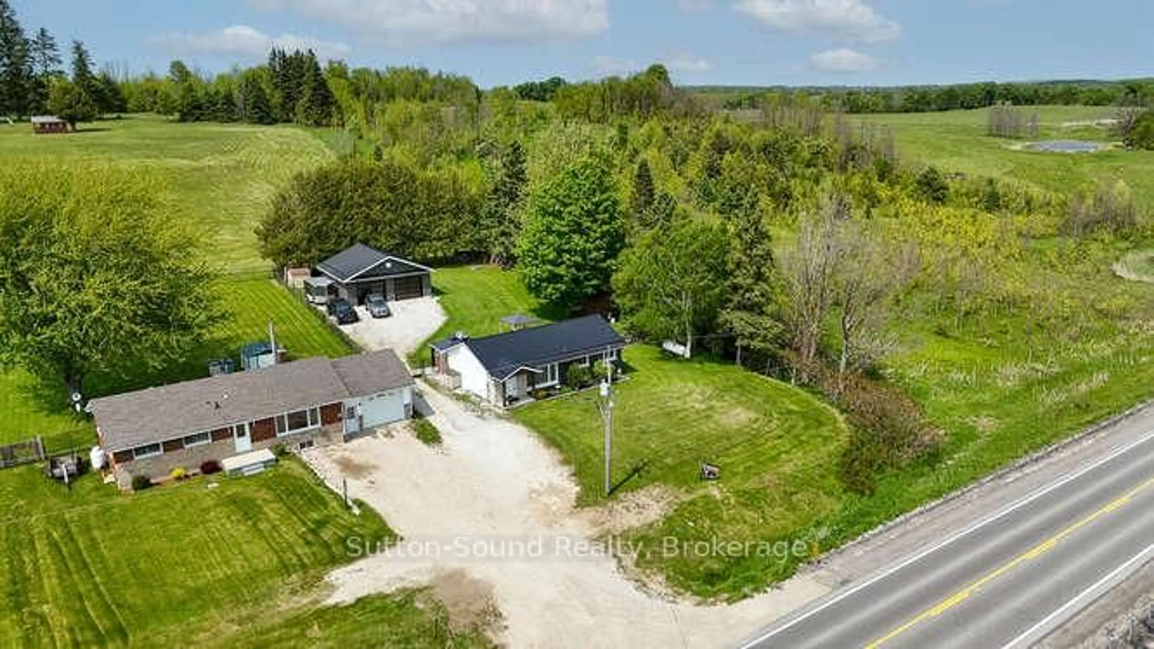 A pic from outside/outdoor area/front of a property/back of a property/a pic from drone, street for 202093 21 Highway, Georgian Bluffs Ontario N4K 5N7