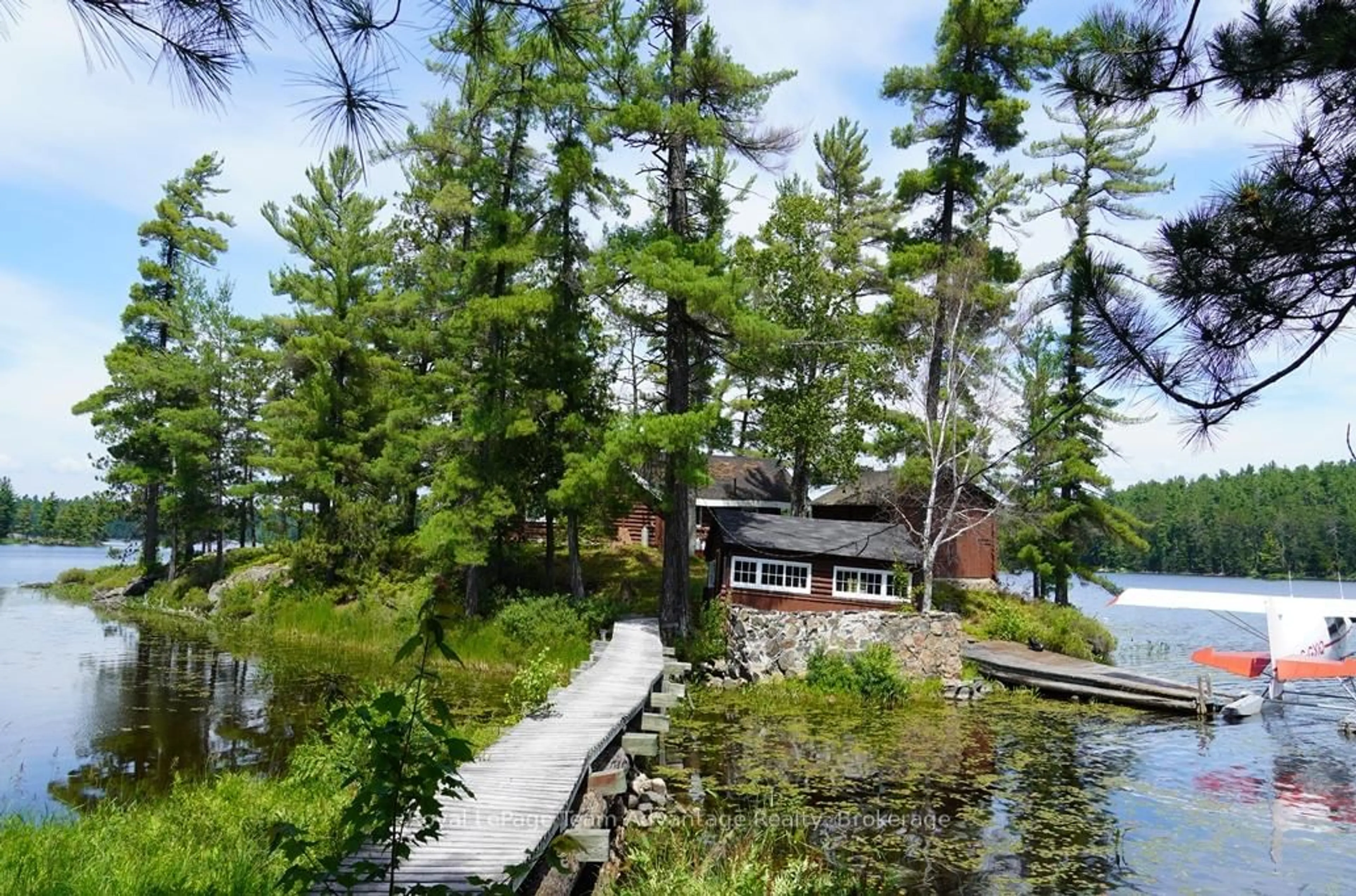 A pic from outside/outdoor area/front of a property/back of a property/a pic from drone, water/lake/river/ocean view for AE 380 & JDD 651 BIRD LAKE, Killarney Ontario P0M 2A0