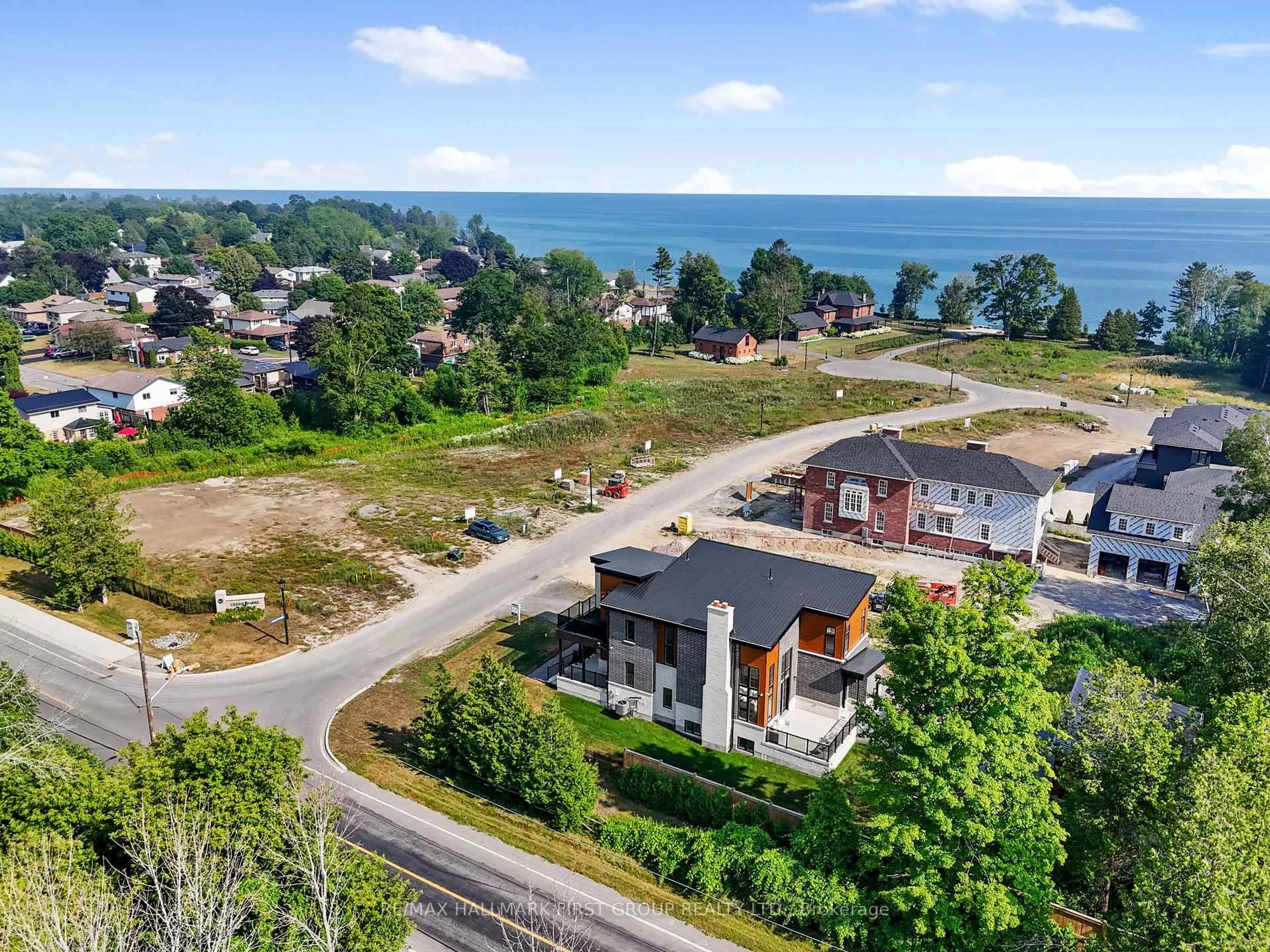 A pic from outside/outdoor area/front of a property/back of a property/a pic from drone, water/lake/river/ocean view for 213 Suzanne Mess Blvd, Cobourg Ontario K9A 3L3