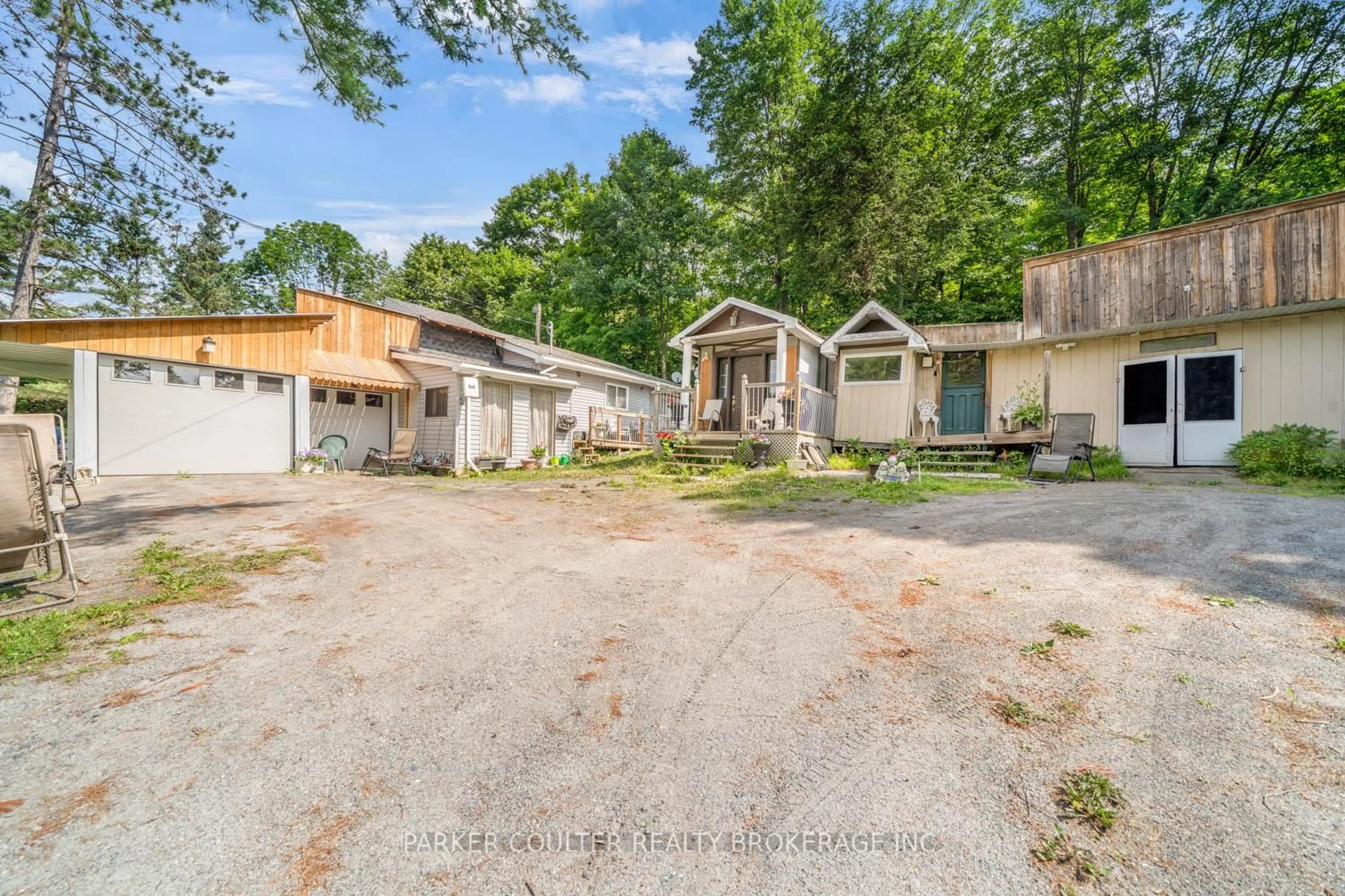 A pic from outside/outdoor area/front of a property/back of a property/a pic from drone, street for 1291 Muskoka Rd 118, Bracebridge Ontario P1L 1W8