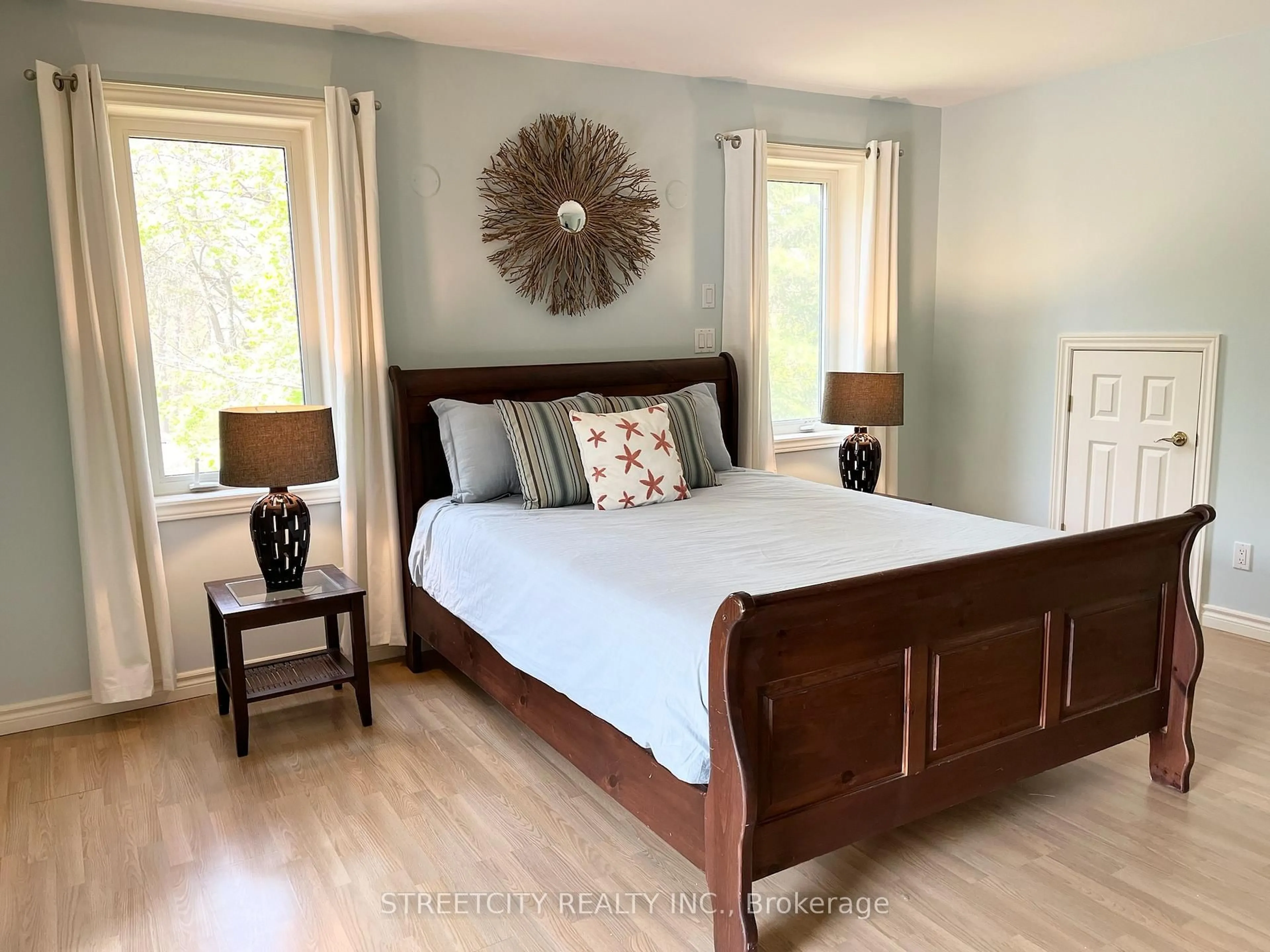 Bedroom with bed, wood/laminate floor for 17 Summit Ave, South Huron Ontario N0M 1T0