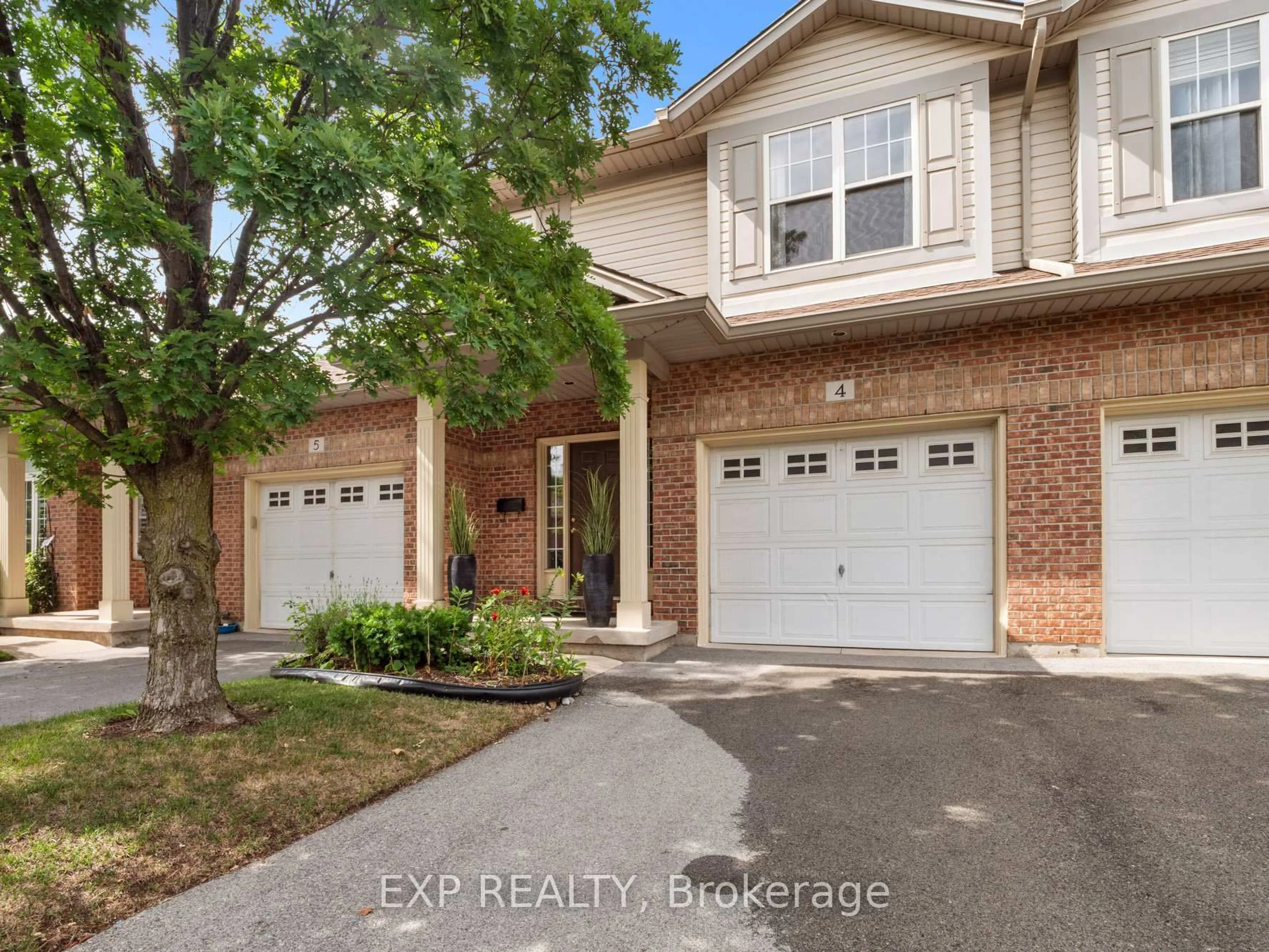 Home with brick exterior material, street for 5595 Drummond Rd #4, Niagara Falls Ontario L2G 4L2