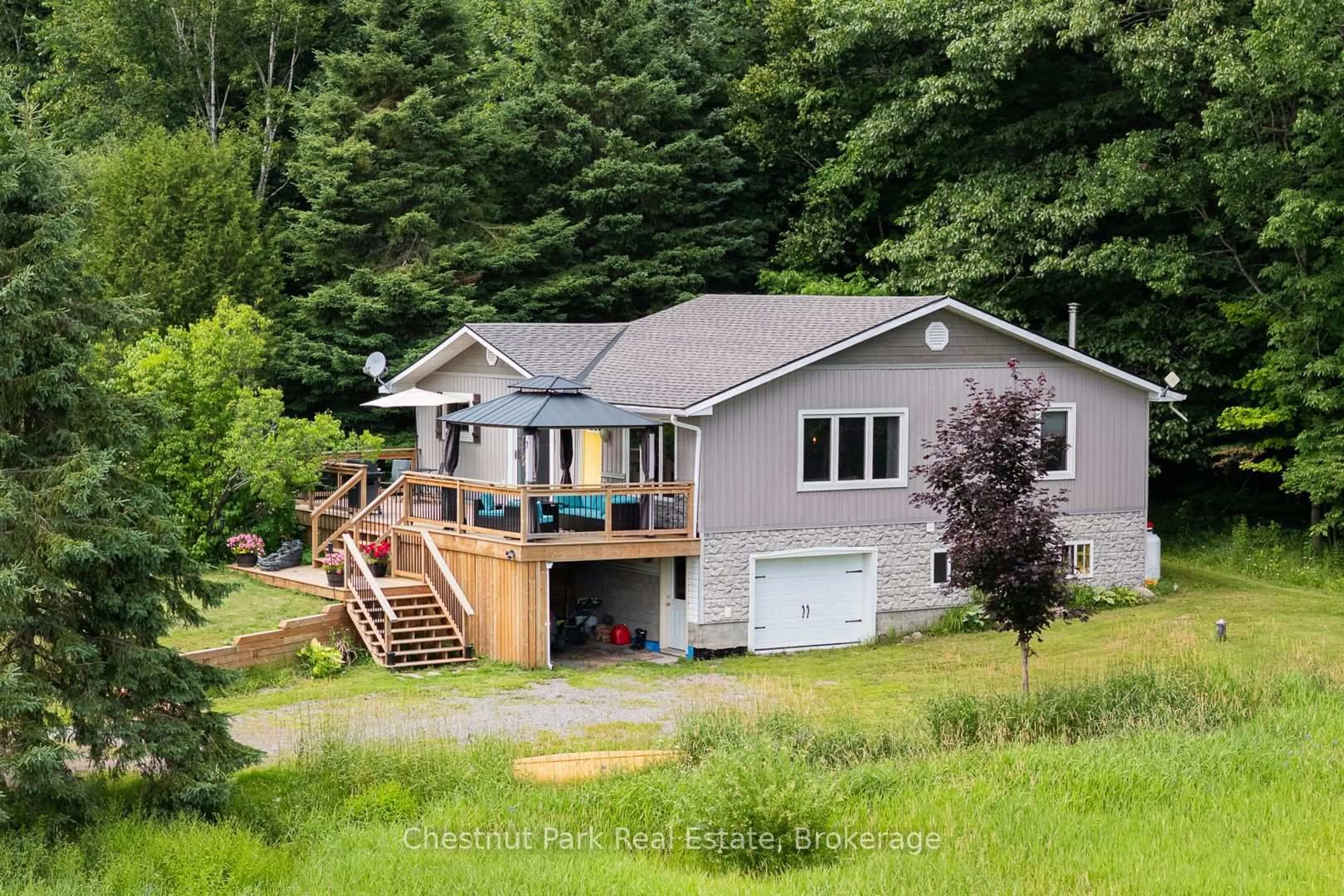 A pic from outside/outdoor area/front of a property/back of a property/a pic from drone, water/lake/river/ocean view for 1922 141 Highway, Muskoka Lakes Ontario P0B 1M0