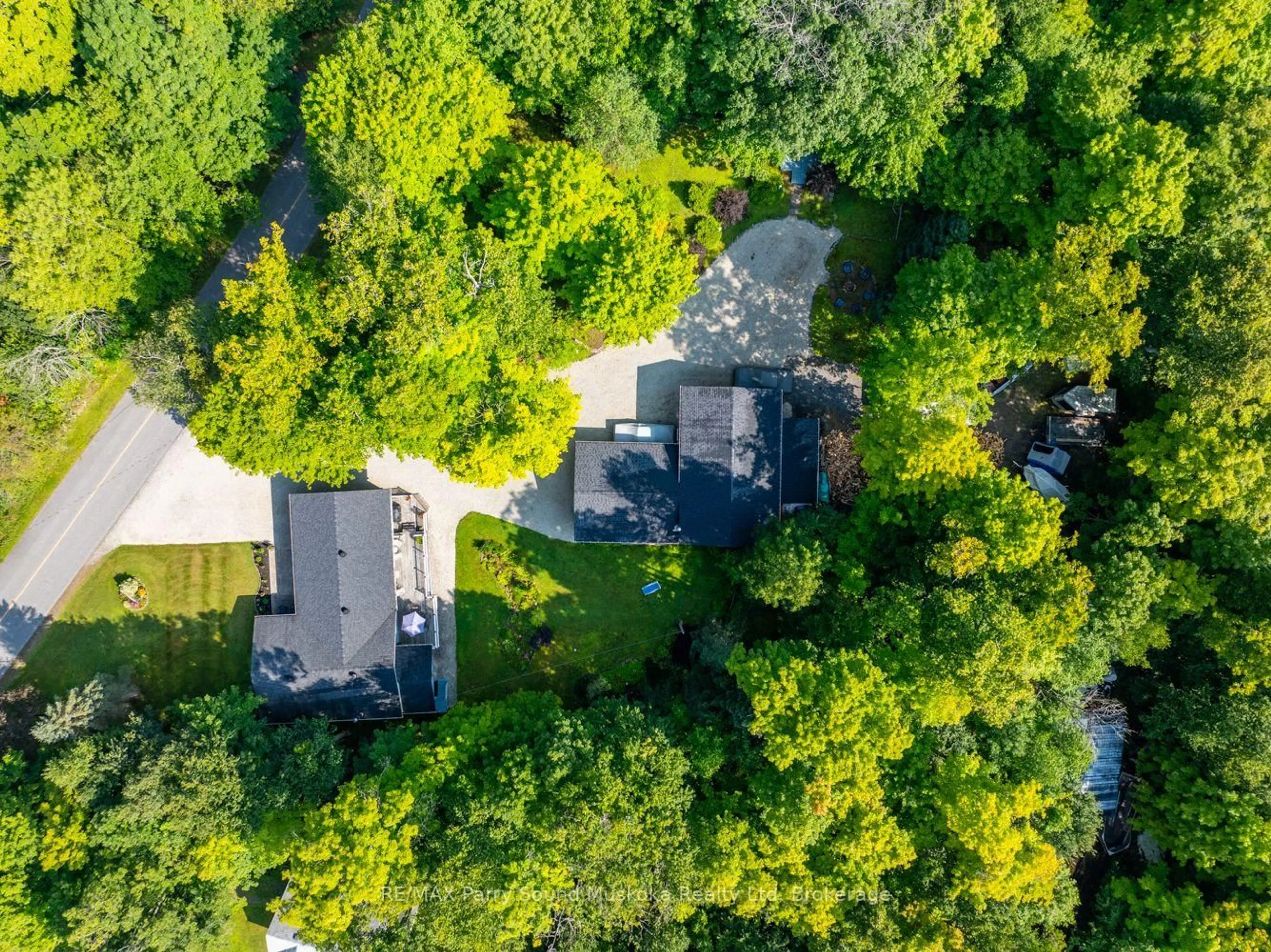 A pic from outside/outdoor area/front of a property/back of a property/a pic from drone, forest/trees view for 3 & 5 SQUIRREL Ave, McDougall Ontario P2A 2W7