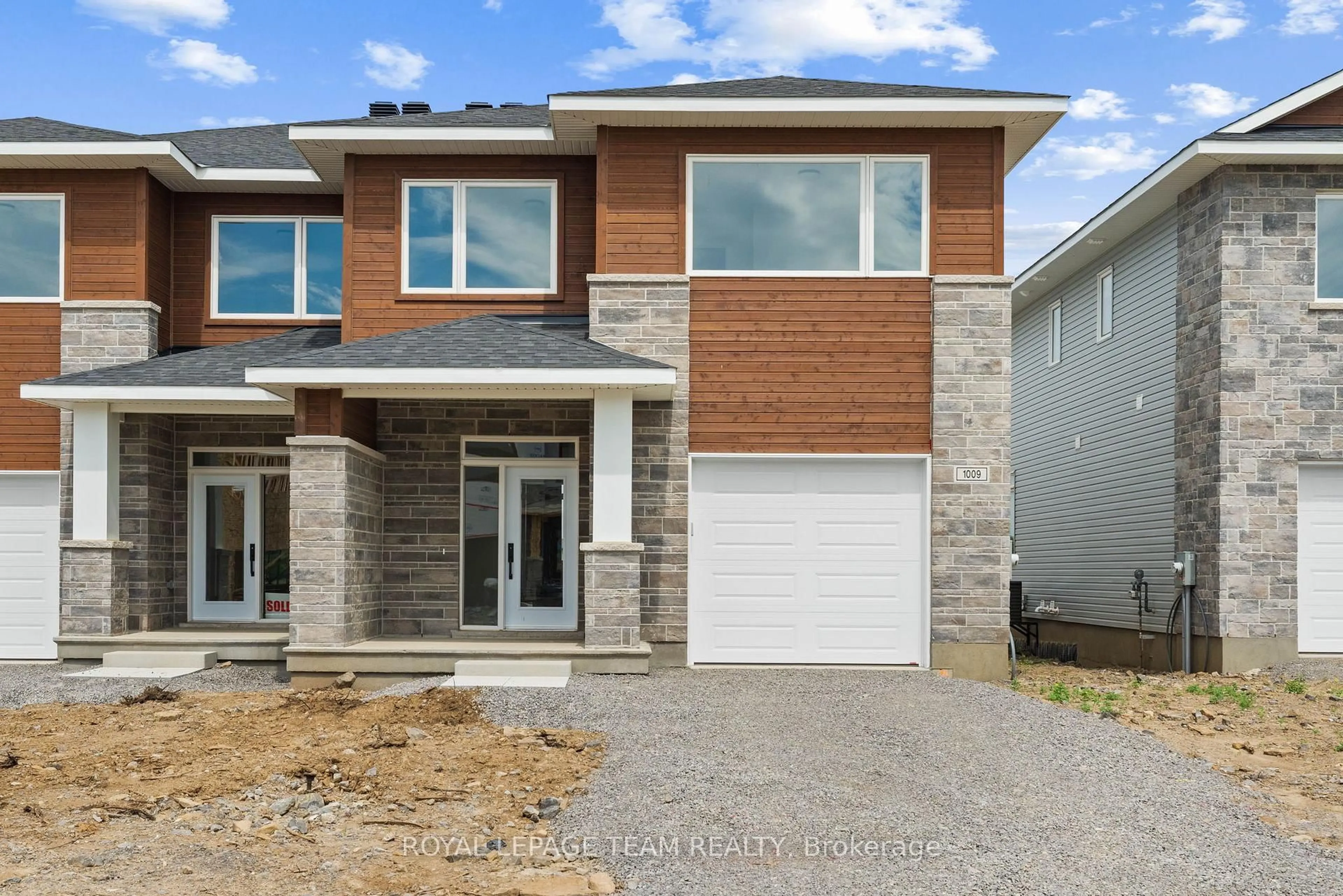 Home with brick exterior material, street for 1004 Moore St, Brockville Ontario K6V 7N1
