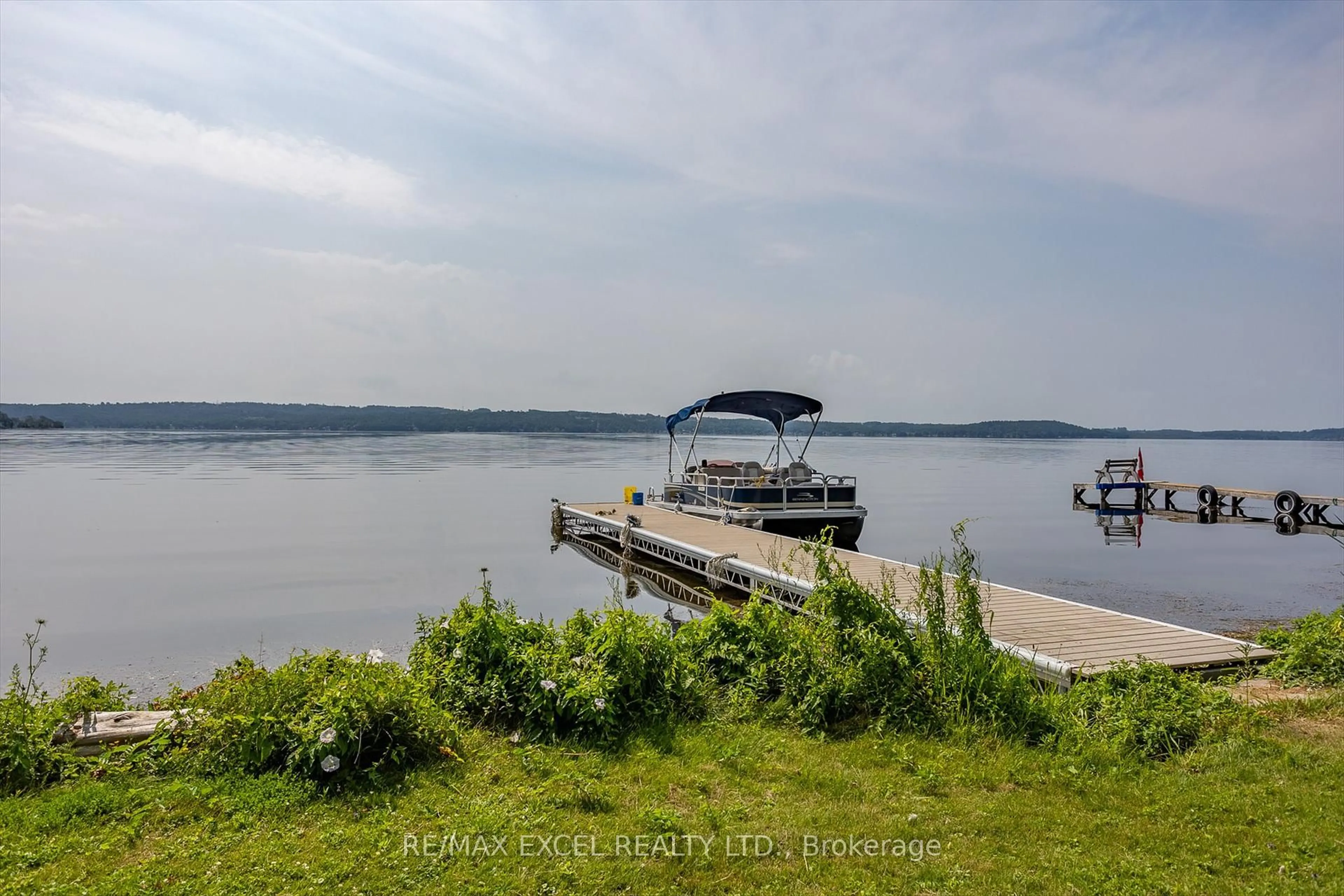 A pic from outside/outdoor area/front of a property/back of a property/a pic from drone, water/lake/river/ocean view for 665 North Shore Dr, Otonabee-South Monaghan Ontario P7B 6B3