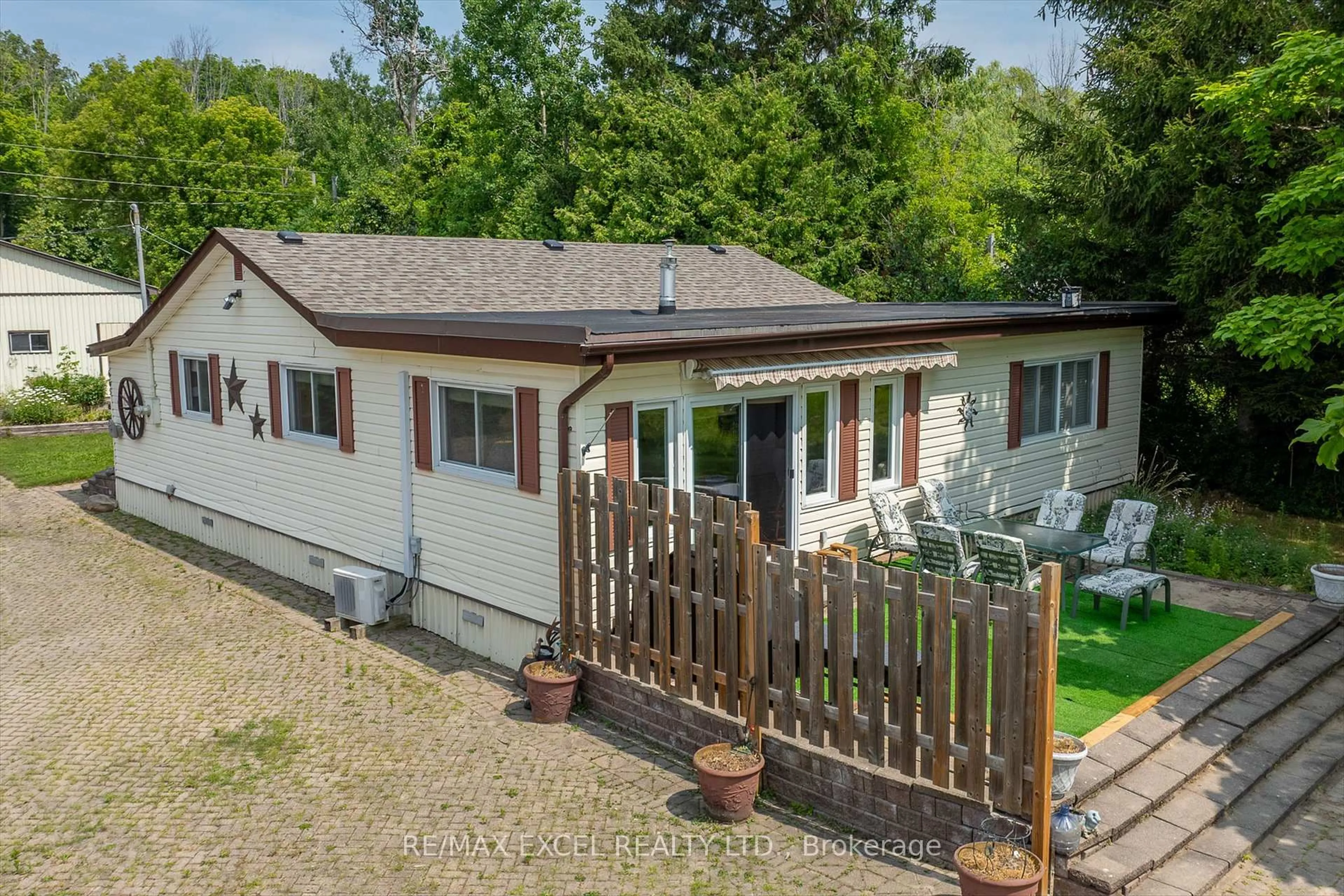 A pic from outside/outdoor area/front of a property/back of a property/a pic from drone, unknown for 665 North Shore Dr, Otonabee-South Monaghan Ontario P7B 6B3