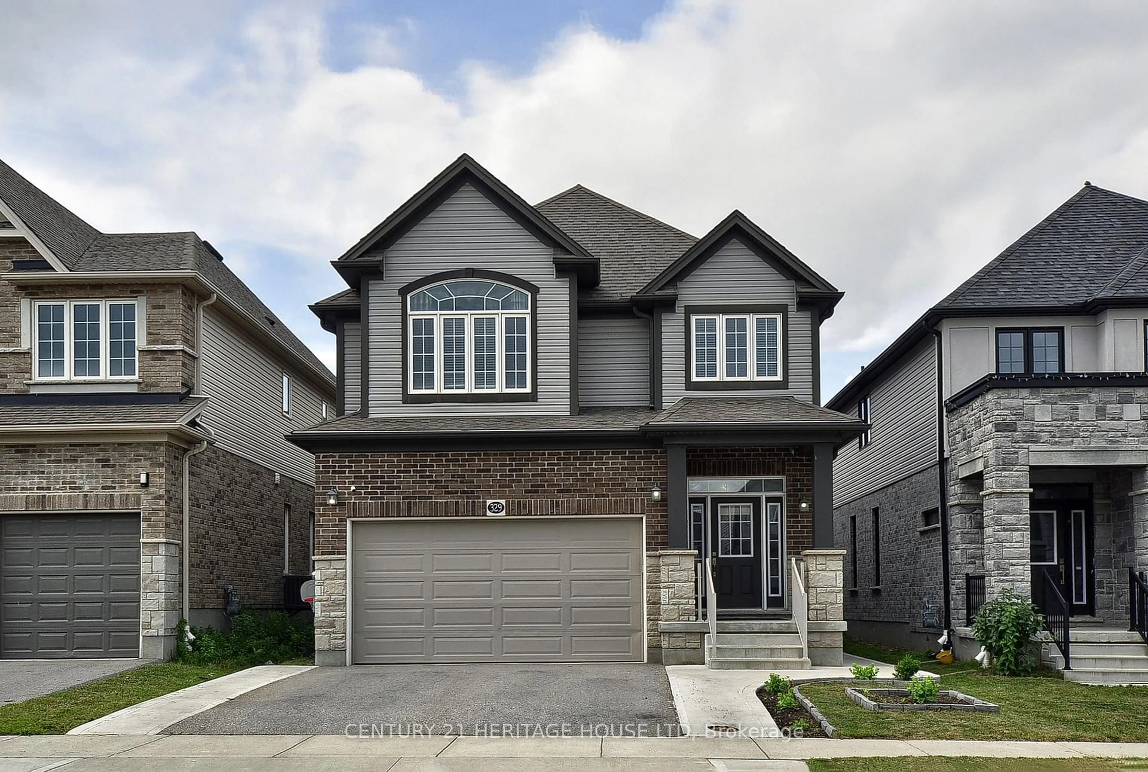 Home with brick exterior material, street for 329 Sedgewood St, Kitchener Ontario N2P 0H9