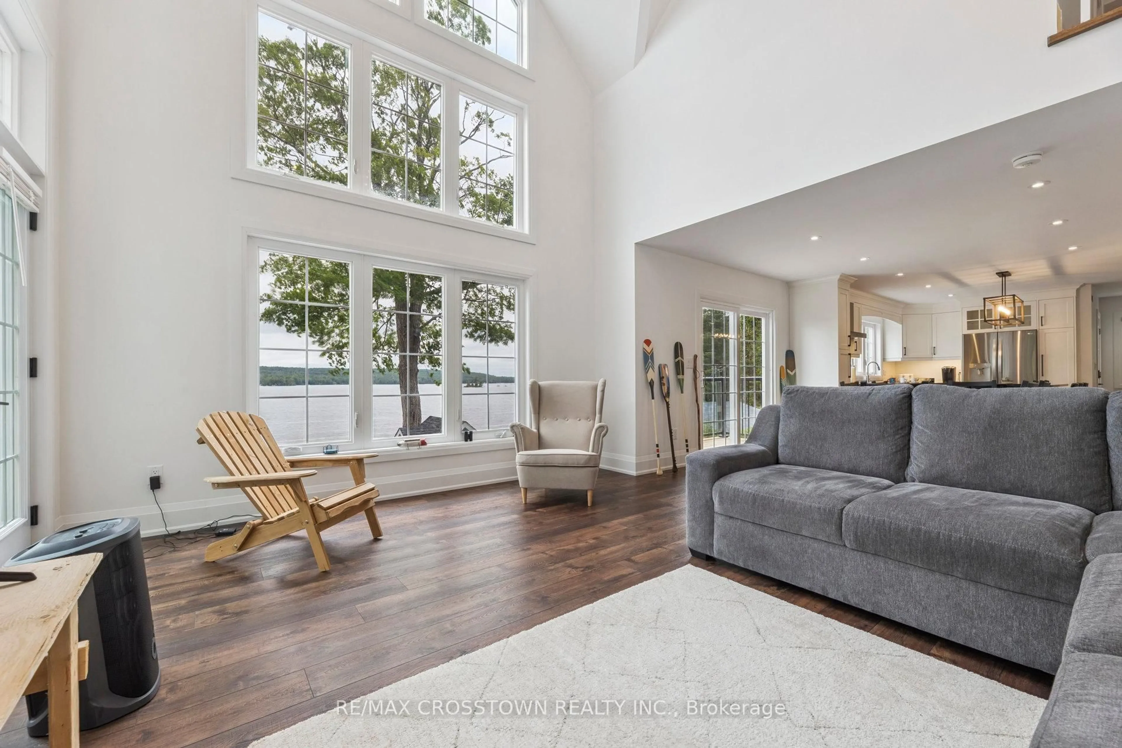 Living room with furniture, wood/laminate floor for 2402 Victoria Springs Lane, Selwyn Ontario K0L 2H0