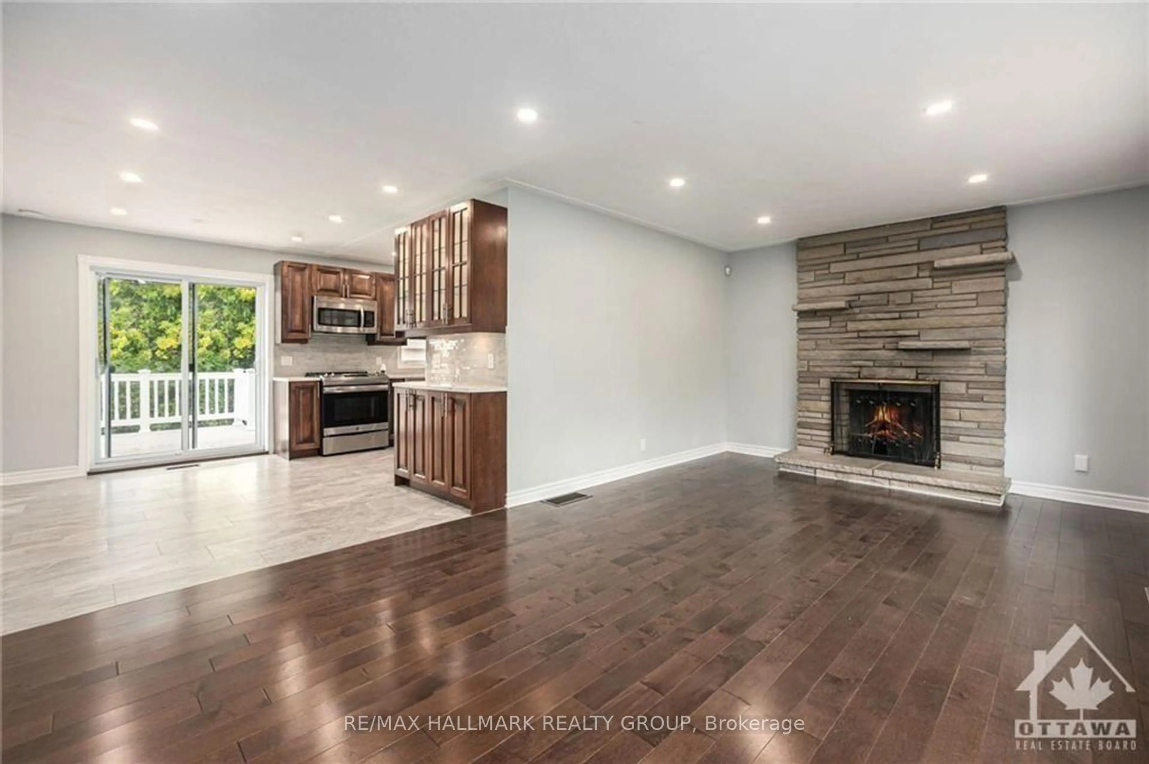Open concept kitchen, wood/laminate floor for 1680 Fisher Ave, Ottawa Ontario K2C 1X7