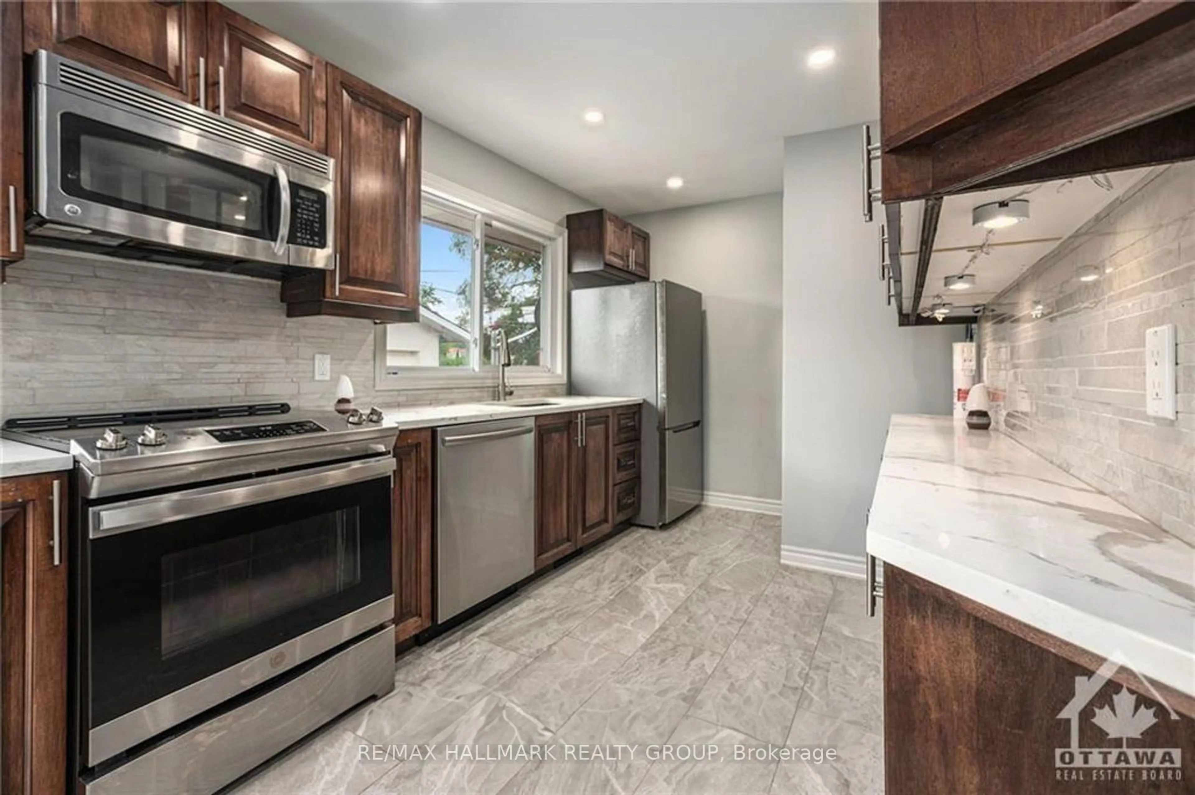 Open concept kitchen, ceramic/tile floor for 1680 Fisher Ave, Ottawa Ontario K2C 1X7