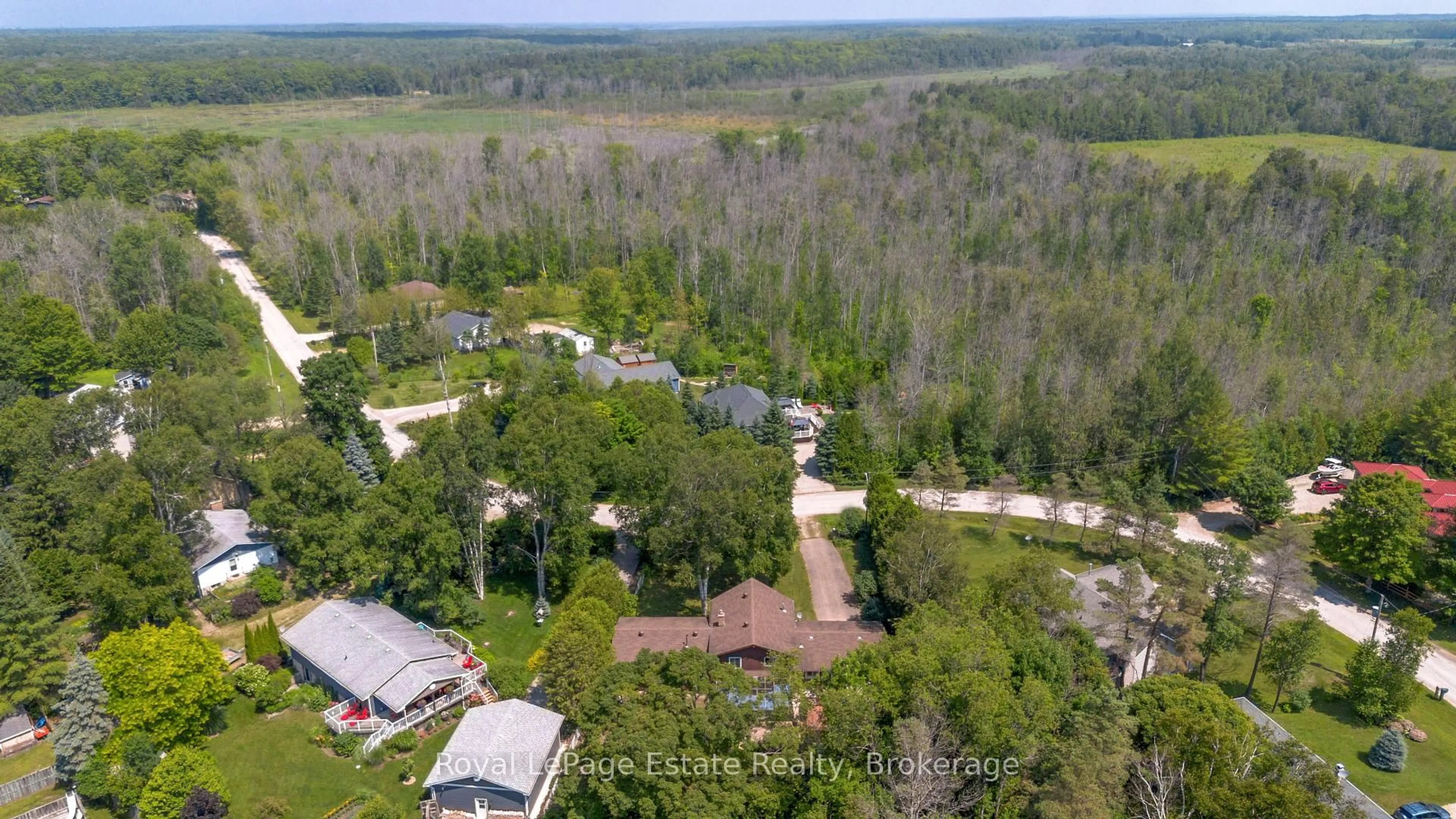A pic from outside/outdoor area/front of a property/back of a property/a pic from drone, forest/trees view for 97 Dorena Cres, South Bruce Peninsula Ontario N0H 2G0