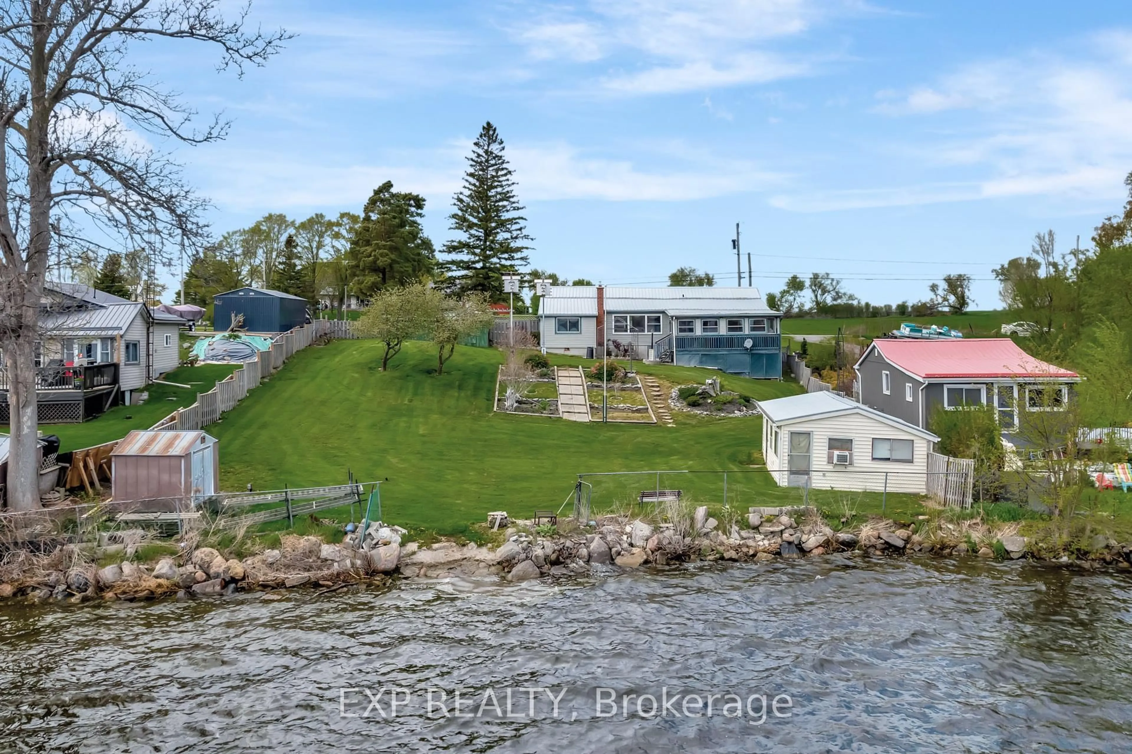 A pic from outside/outdoor area/front of a property/back of a property/a pic from drone, water/lake/river/ocean view for 1083 Lakeside Dr, Prince Edward County Ontario K0K 1T0
