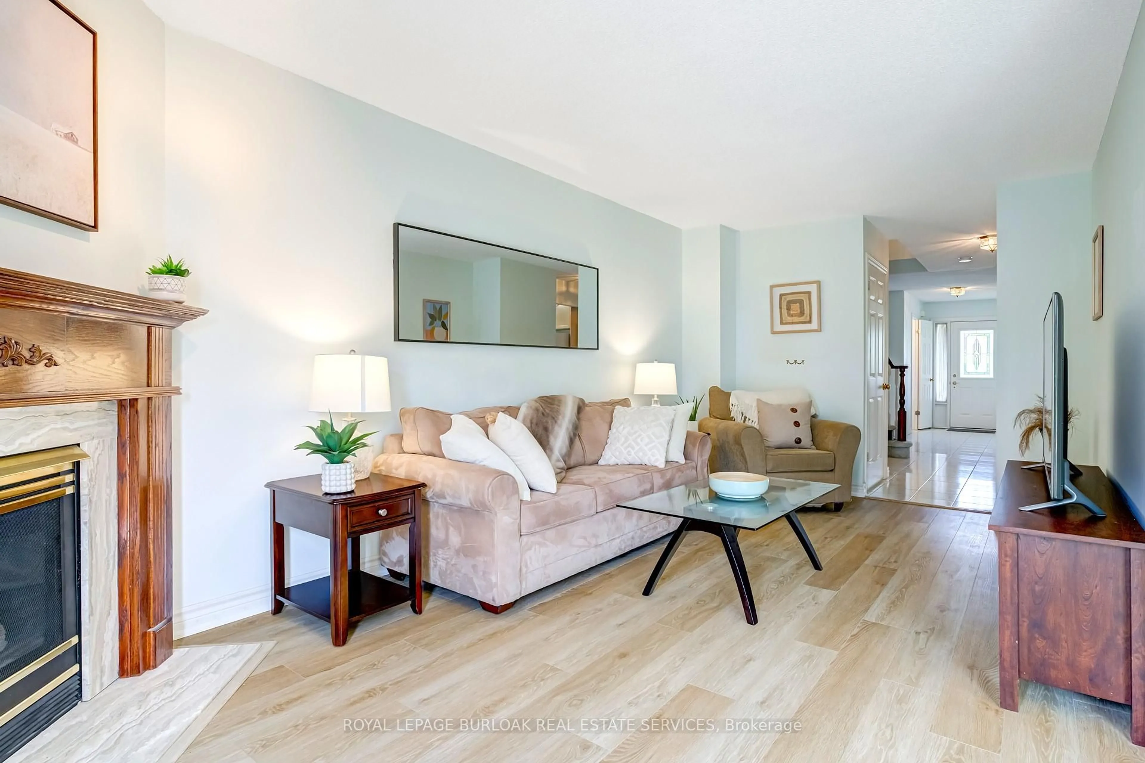 Living room with furniture, wood/laminate floor for 149 Dicenzo Dr, Hamilton Ontario L9B 2K8