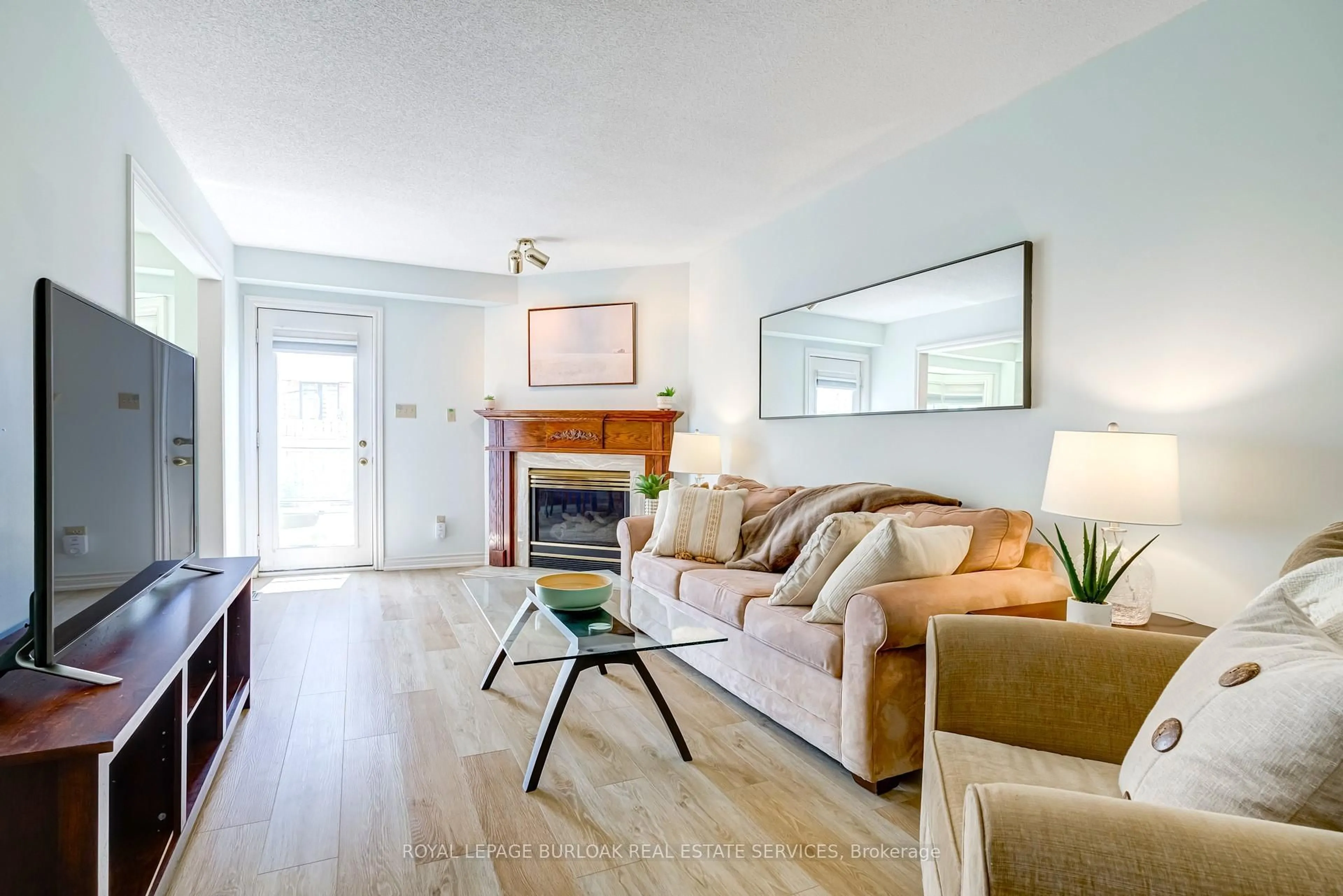 Living room with furniture, wood/laminate floor for 149 Dicenzo Dr, Hamilton Ontario L9B 2K8