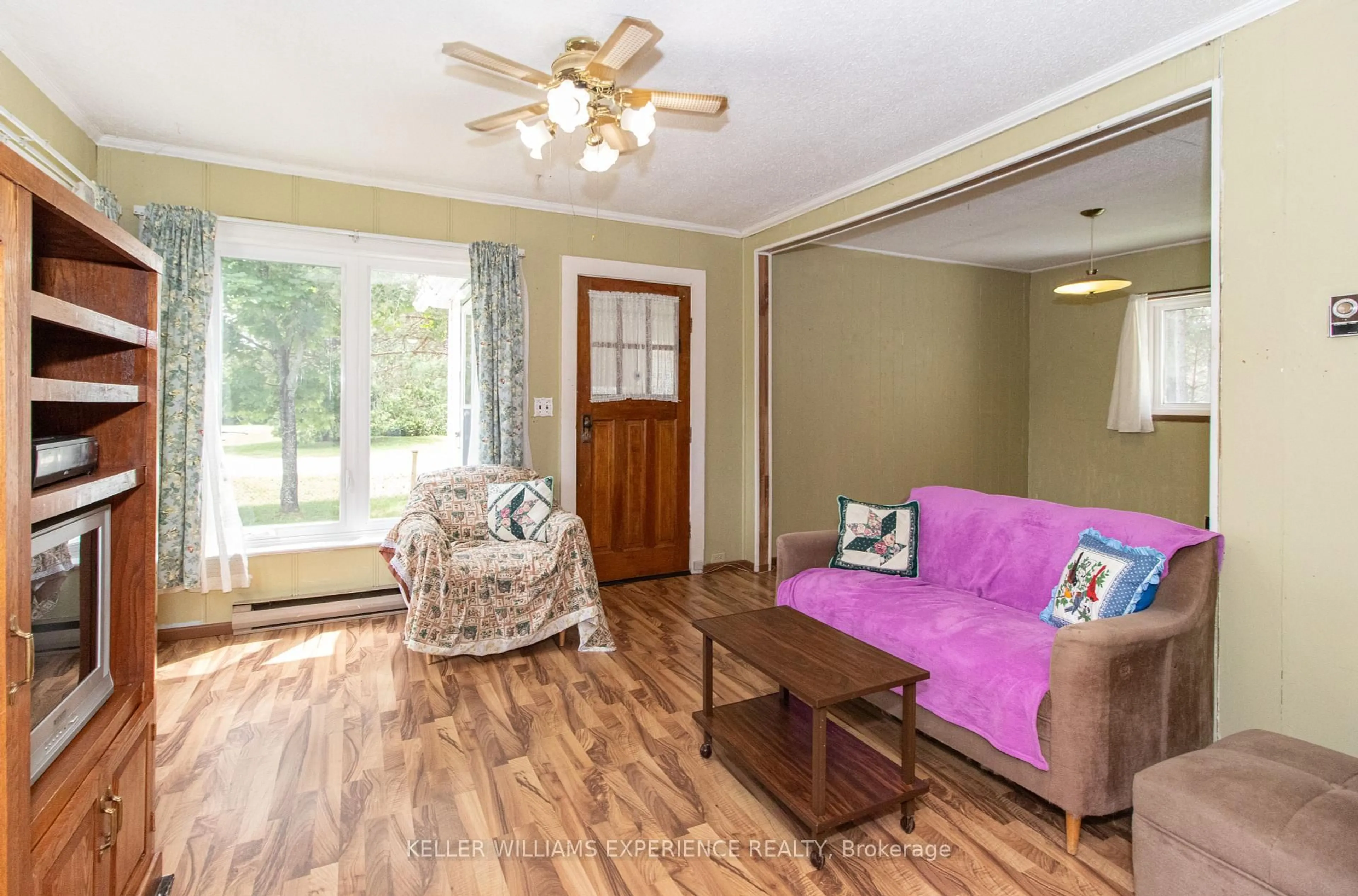 Living room with furniture, wood/laminate floor for 152 Ottawa Ave, South River Ontario P0A 1X0