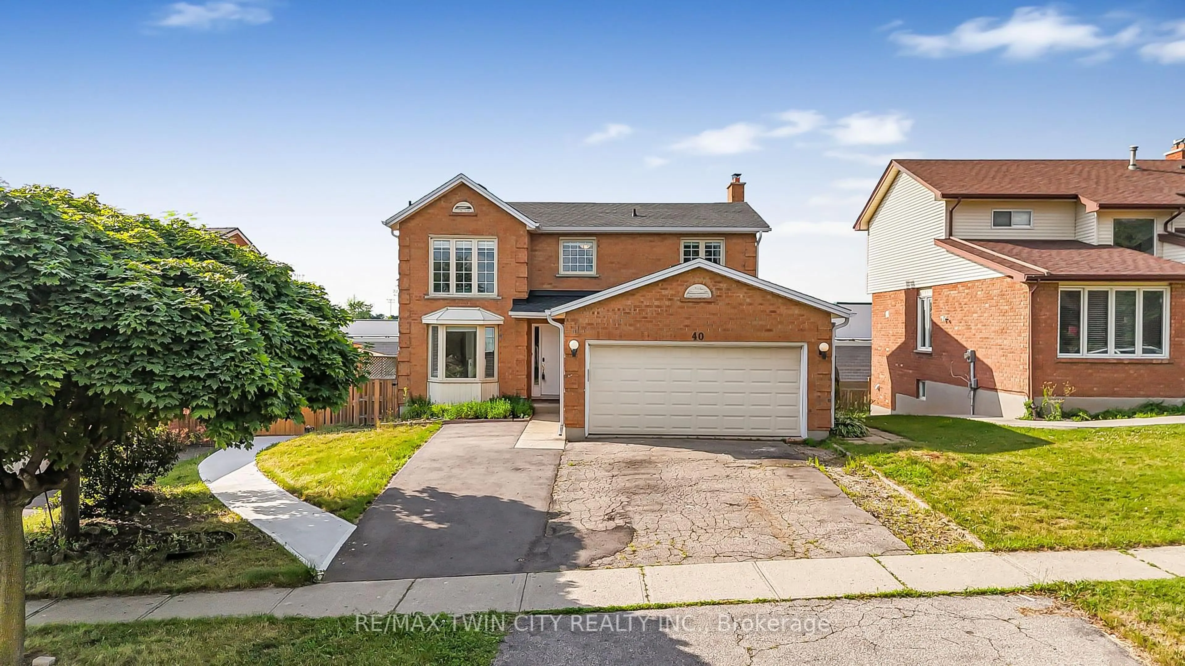 Home with brick exterior material, street for 40 Ebydale Dr, Kitchener Ontario N2A 3N7