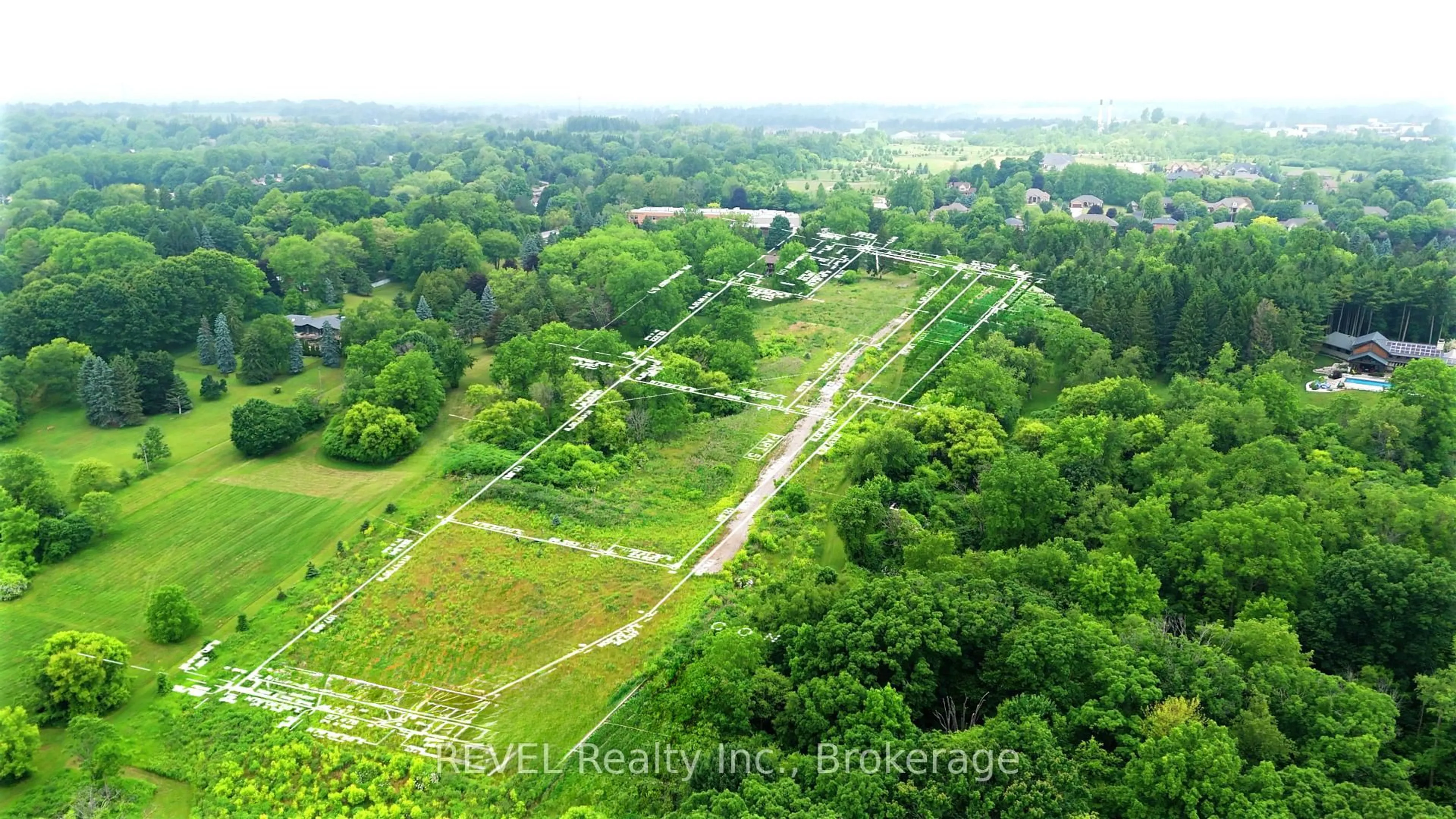 A pic from outside/outdoor area/front of a property/back of a property/a pic from drone, forest/trees view for 610-612-614 Harvest Rd, Hamilton Ontario L9H 5K7