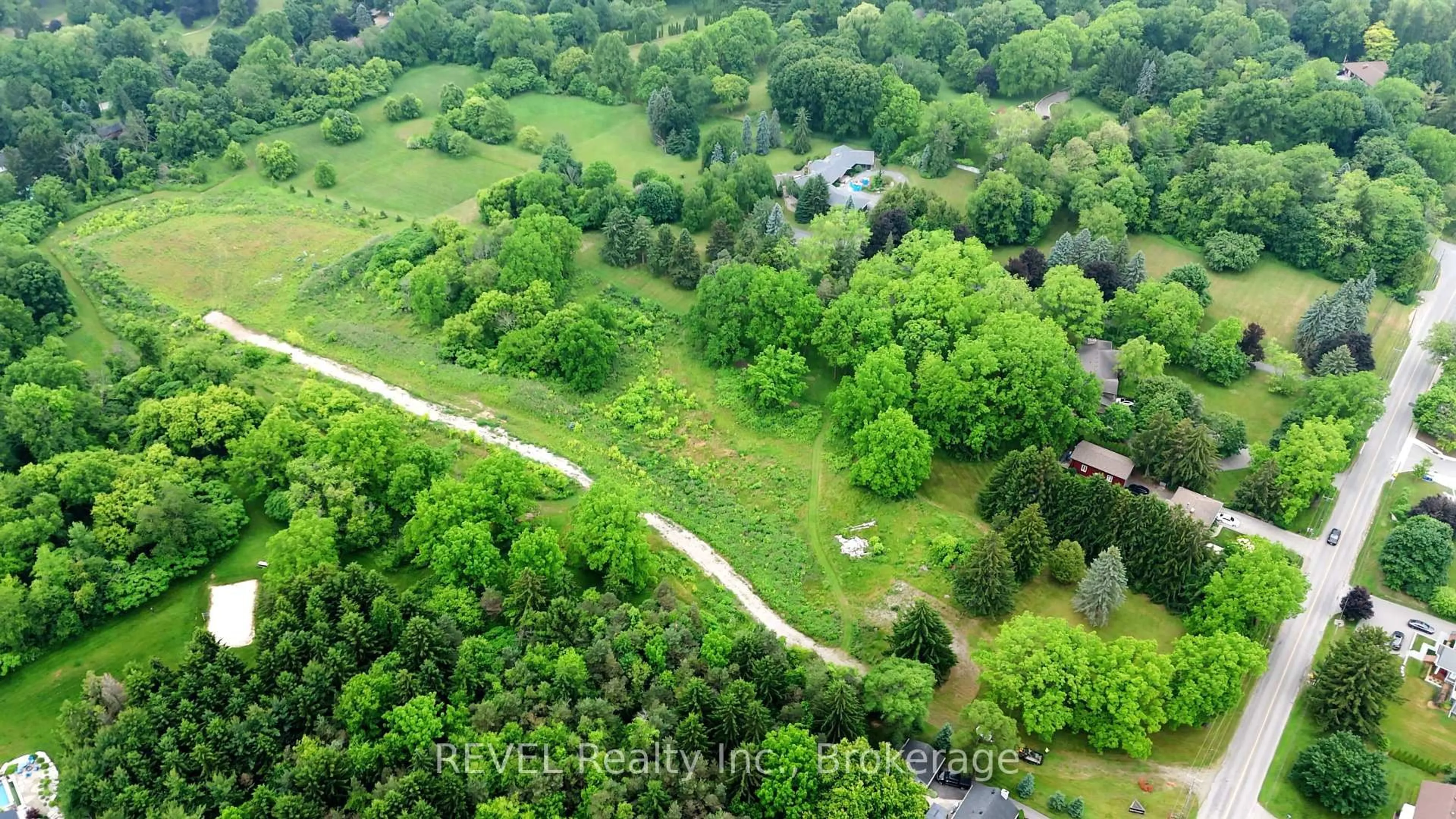 A pic from outside/outdoor area/front of a property/back of a property/a pic from drone, forest/trees view for 610-612-614 Harvest Rd, Hamilton Ontario L9H 5K7