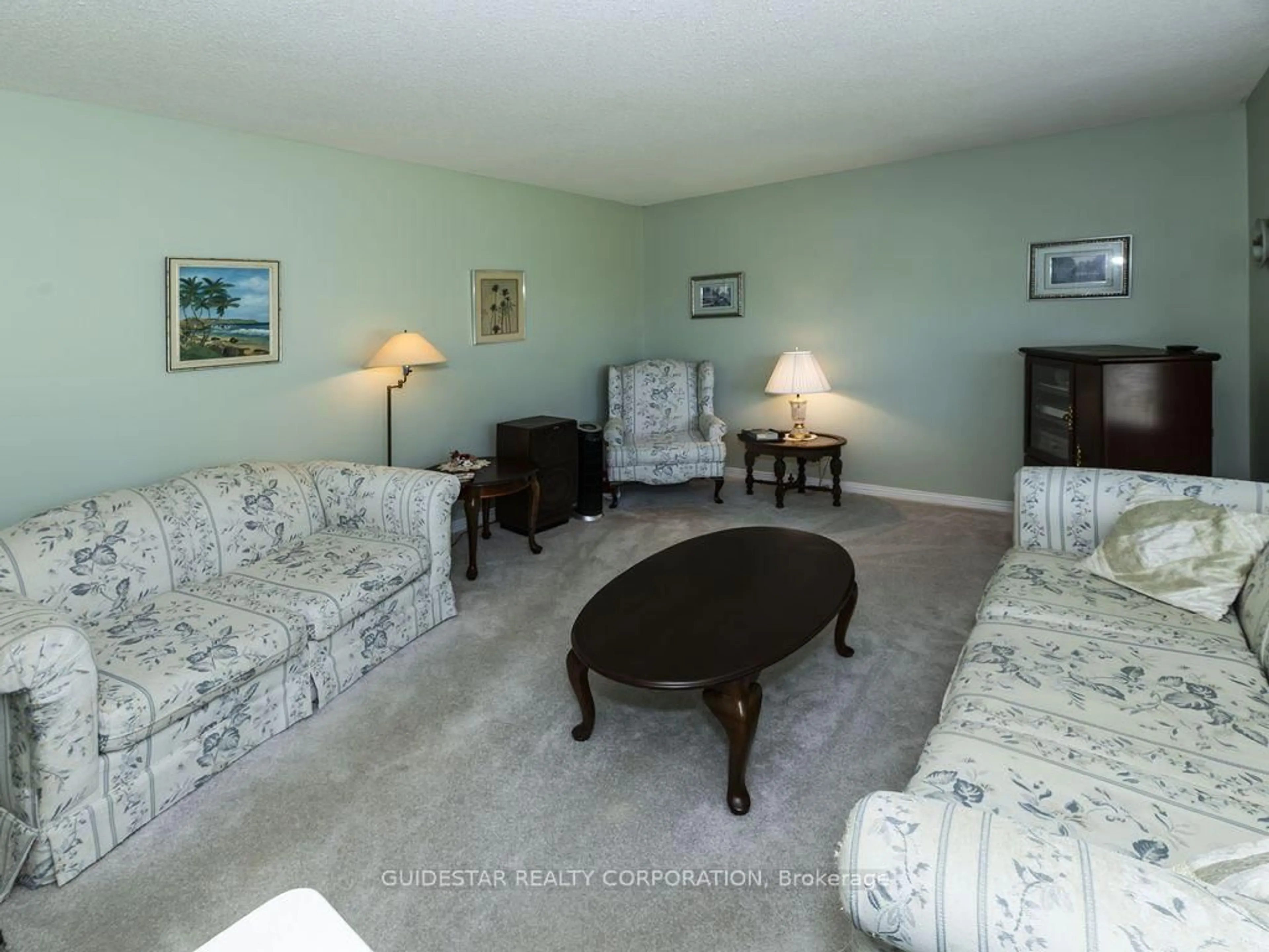 Living room with furniture, carpet floor for 20 Henry Goulburn Way, Stittsville Ontario K2S 1P2