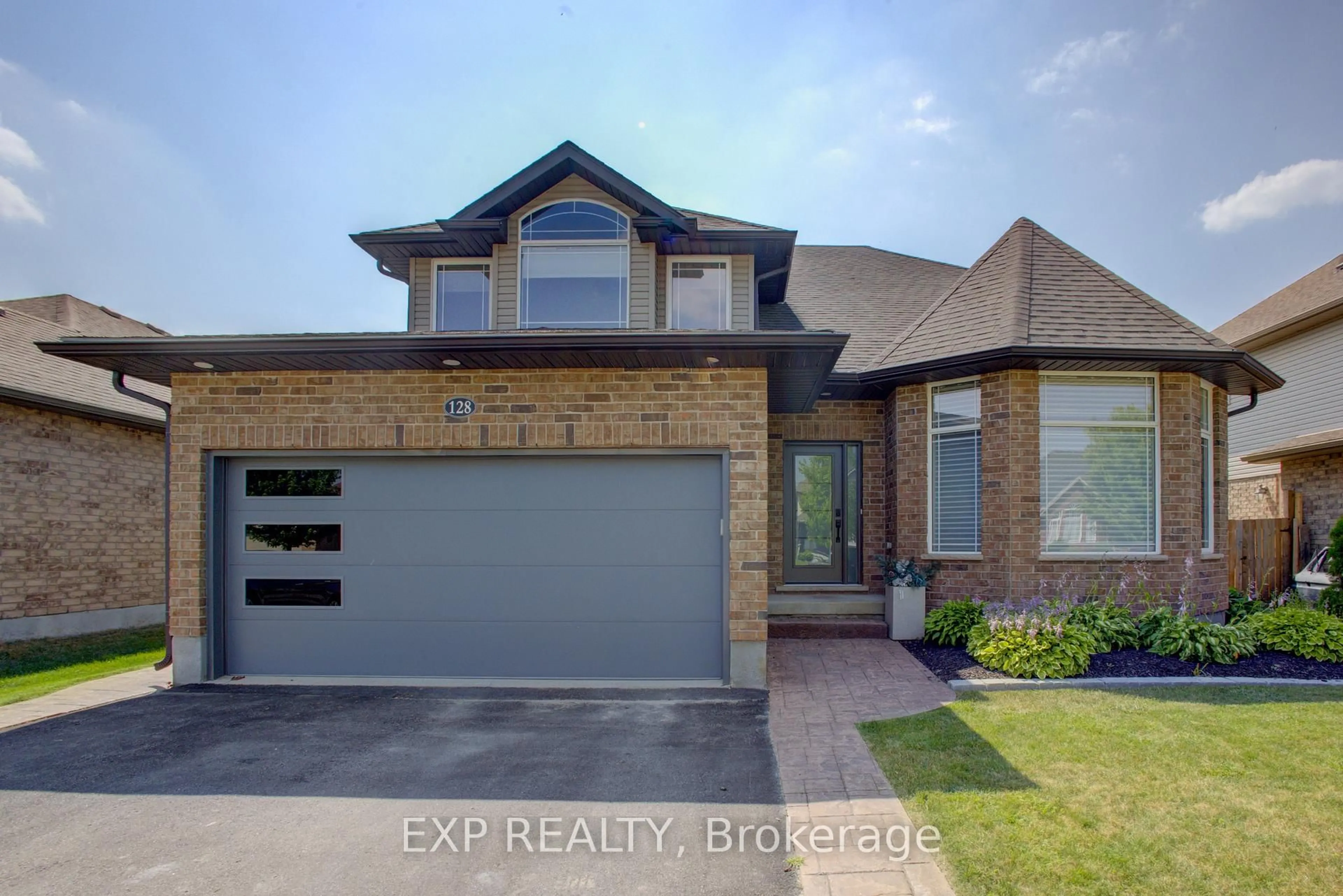Home with brick exterior material, street for 128 Schmidt Dr, Wellington North Ontario N0G 1A0