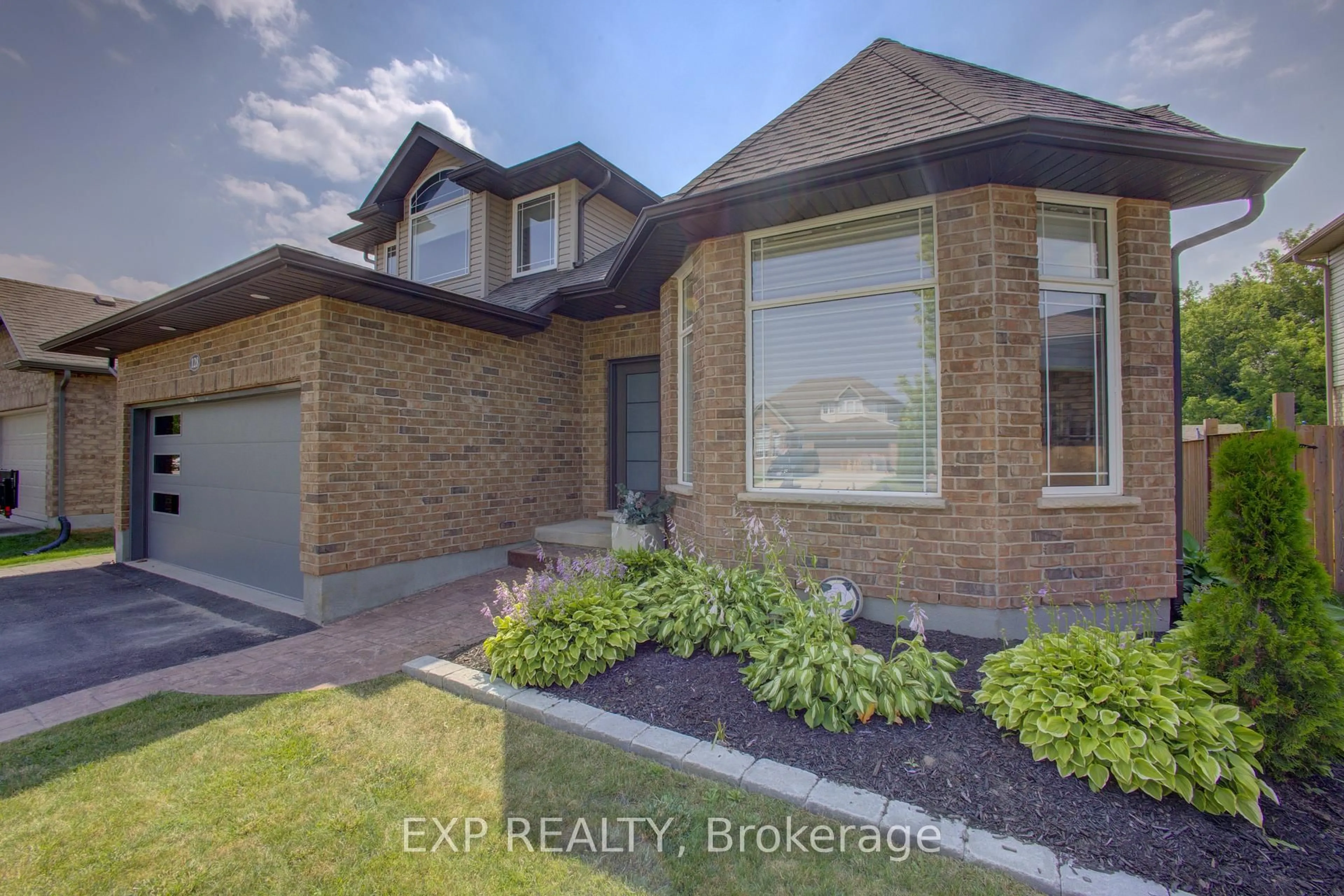 Home with brick exterior material, street for 128 Schmidt Dr, Wellington North Ontario N0G 1A0