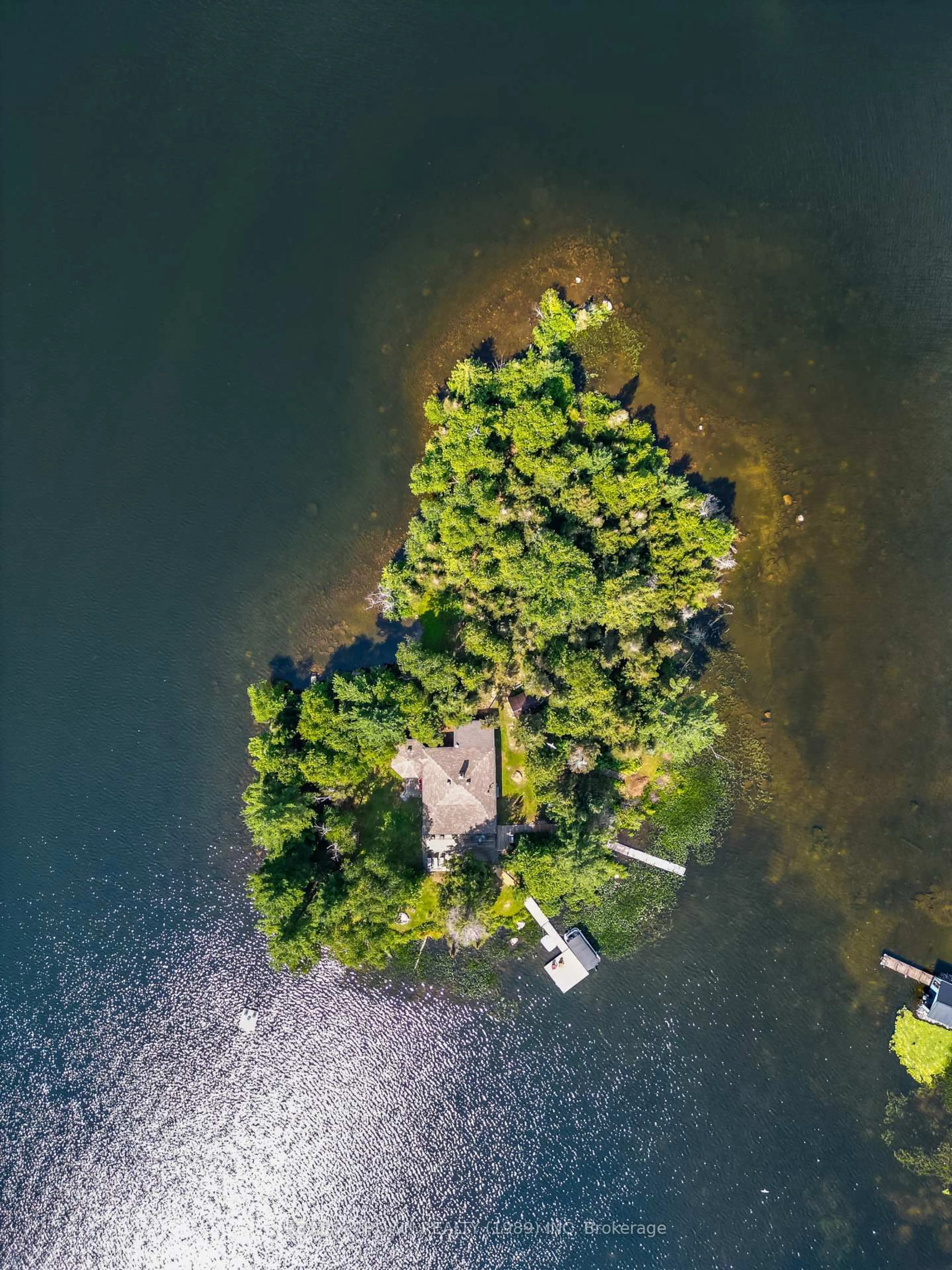 A pic from outside/outdoor area/front of a property/back of a property/a pic from drone, water/lake/river/ocean view for 71 Northwoods Drive C Island, East Ferris Ontario P0H 1K0