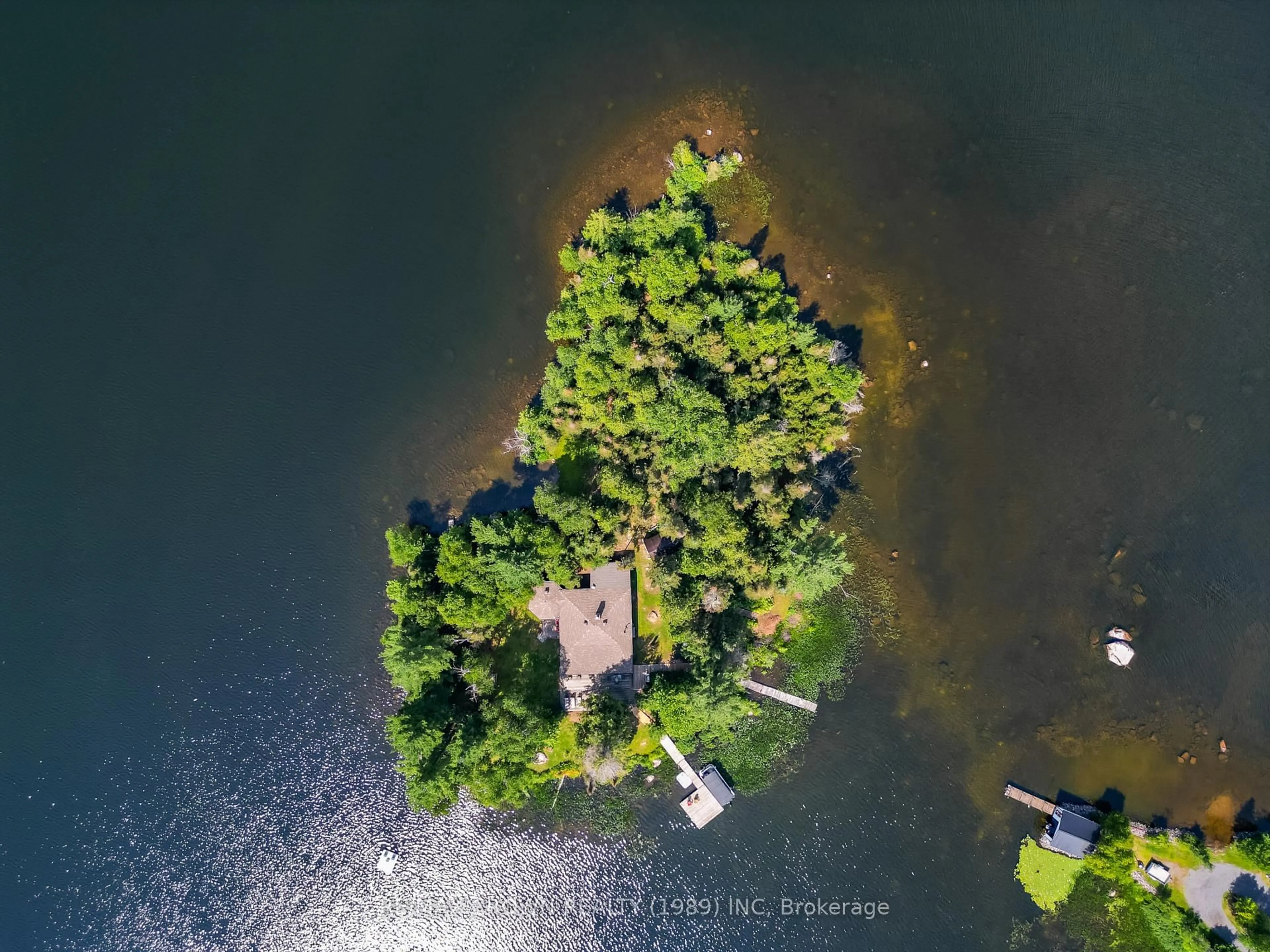 A pic from outside/outdoor area/front of a property/back of a property/a pic from drone, water/lake/river/ocean view for 71 Northwoods Drive C Island, East Ferris Ontario P0H 1K0