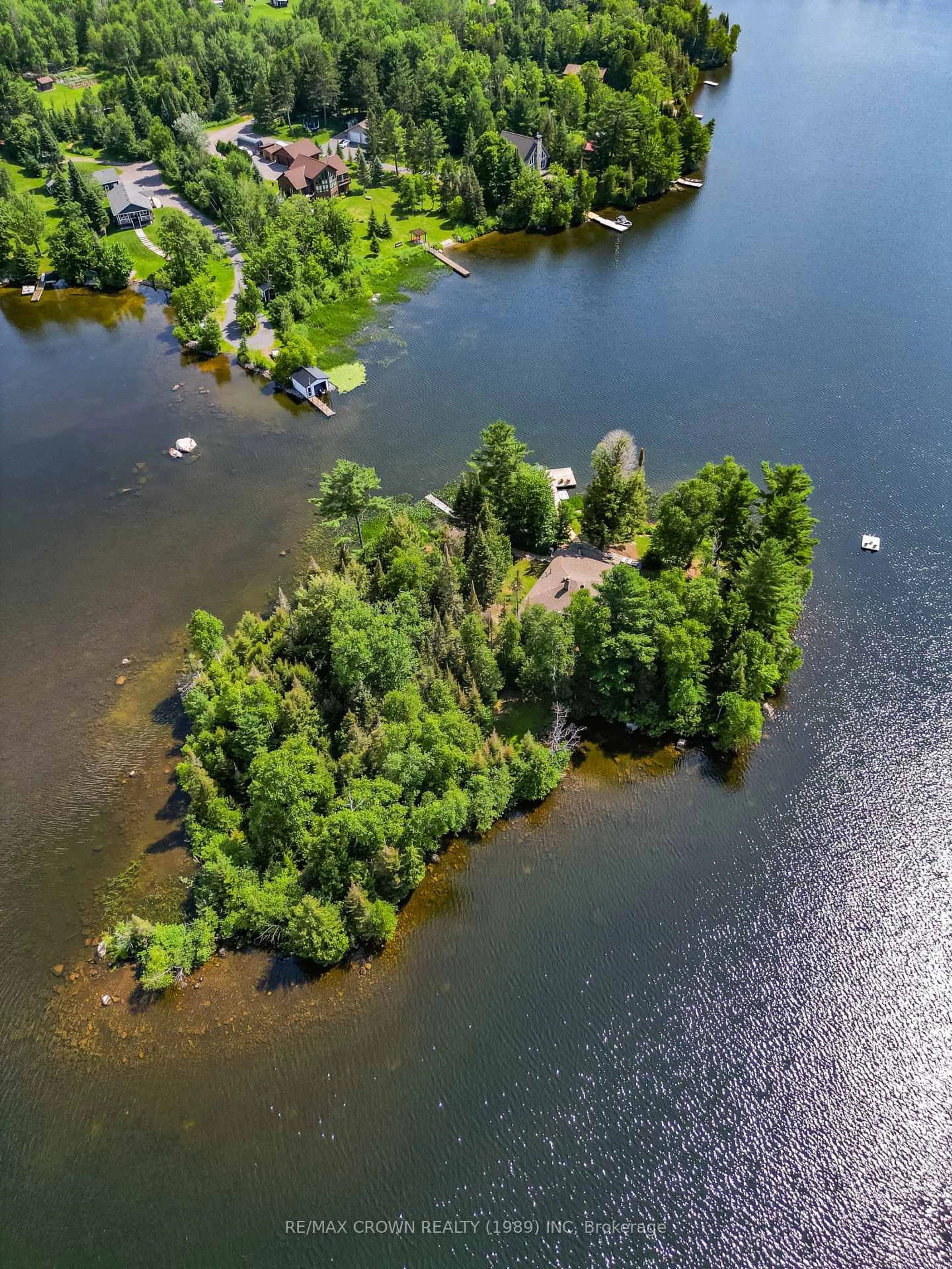 A pic from outside/outdoor area/front of a property/back of a property/a pic from drone, water/lake/river/ocean view for 71 Northwoods Drive C Island, East Ferris Ontario P0H 1K0