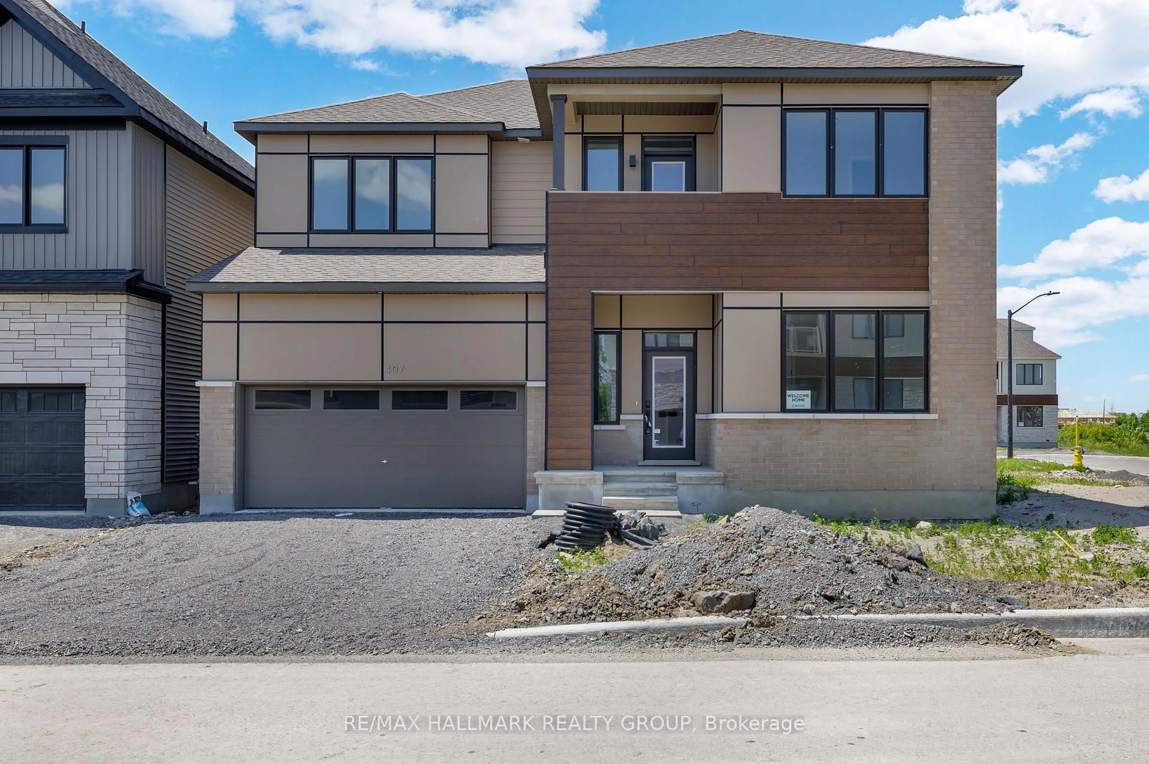 Home with brick exterior material, street for 407 Euphoria Cres, Barrhaven Ontario K2J 7M7