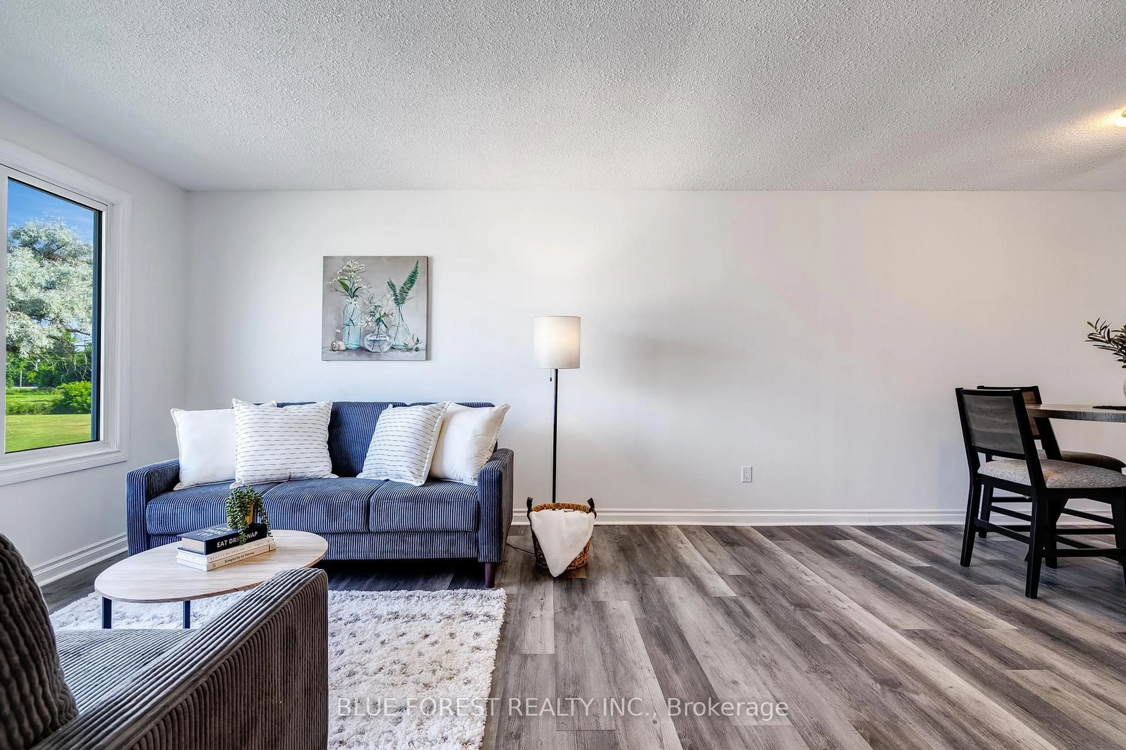 Living room with furniture, wood/laminate floor for 69 Bridle Path Rd, Chatham-Kent Ontario N8A 4Y2