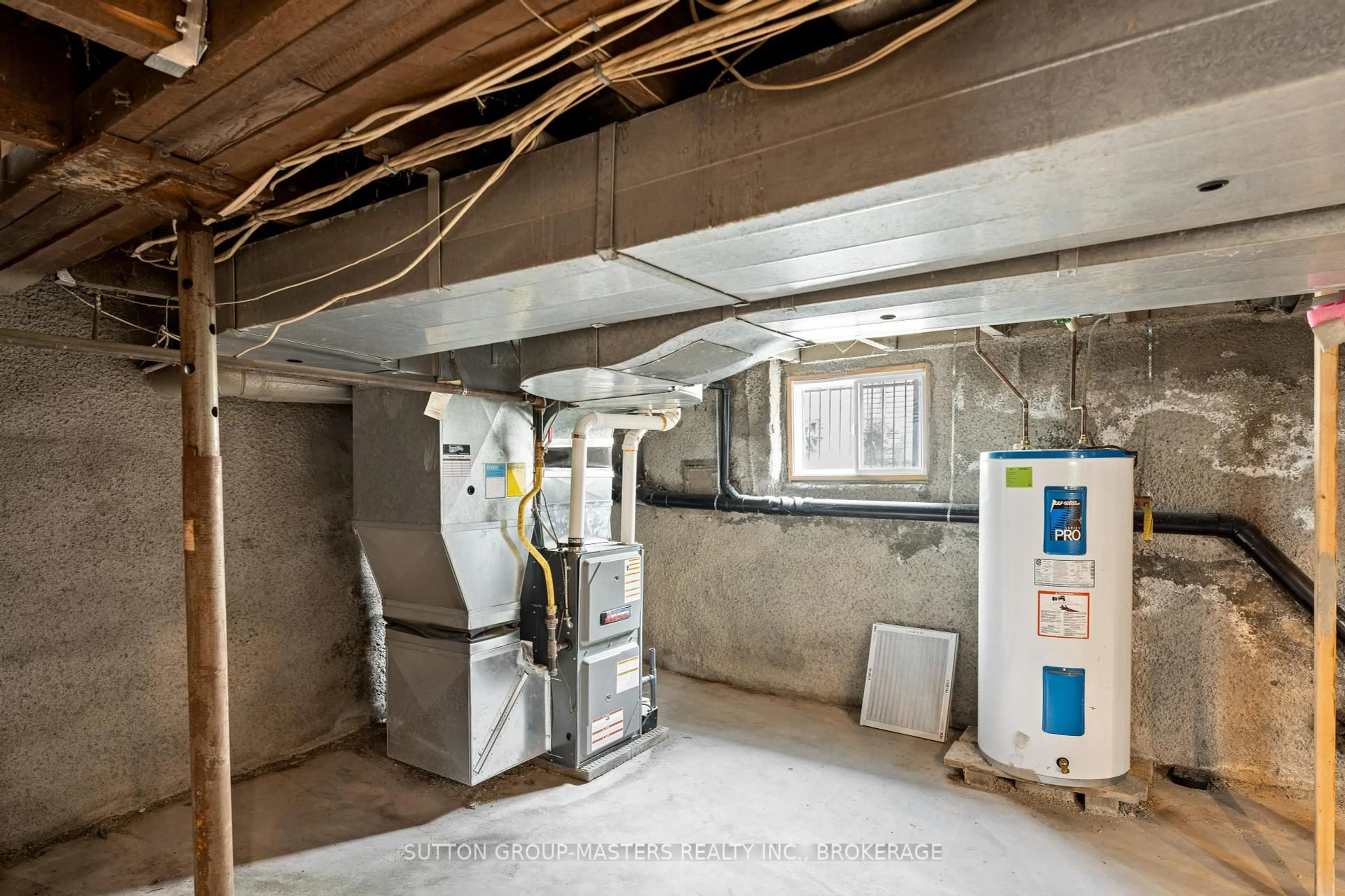 Kitchen with laundary machines, cement floor for 52 Pembroke St, Kingston Ontario K7L 4N4