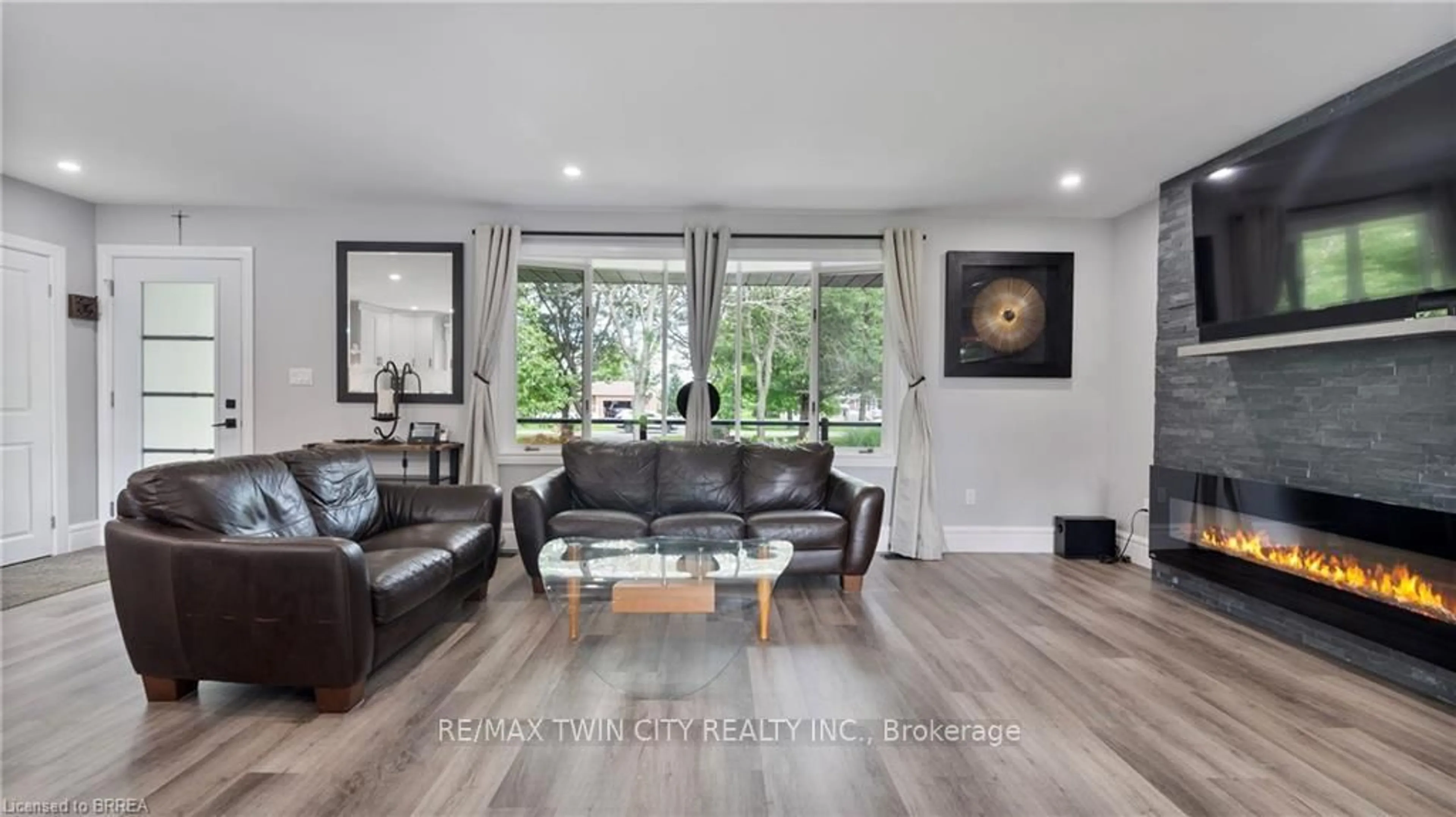 Living room with furniture, wood/laminate floor for 1651 Villa Nova Rd, Norfolk Ontario N0E 1Z0
