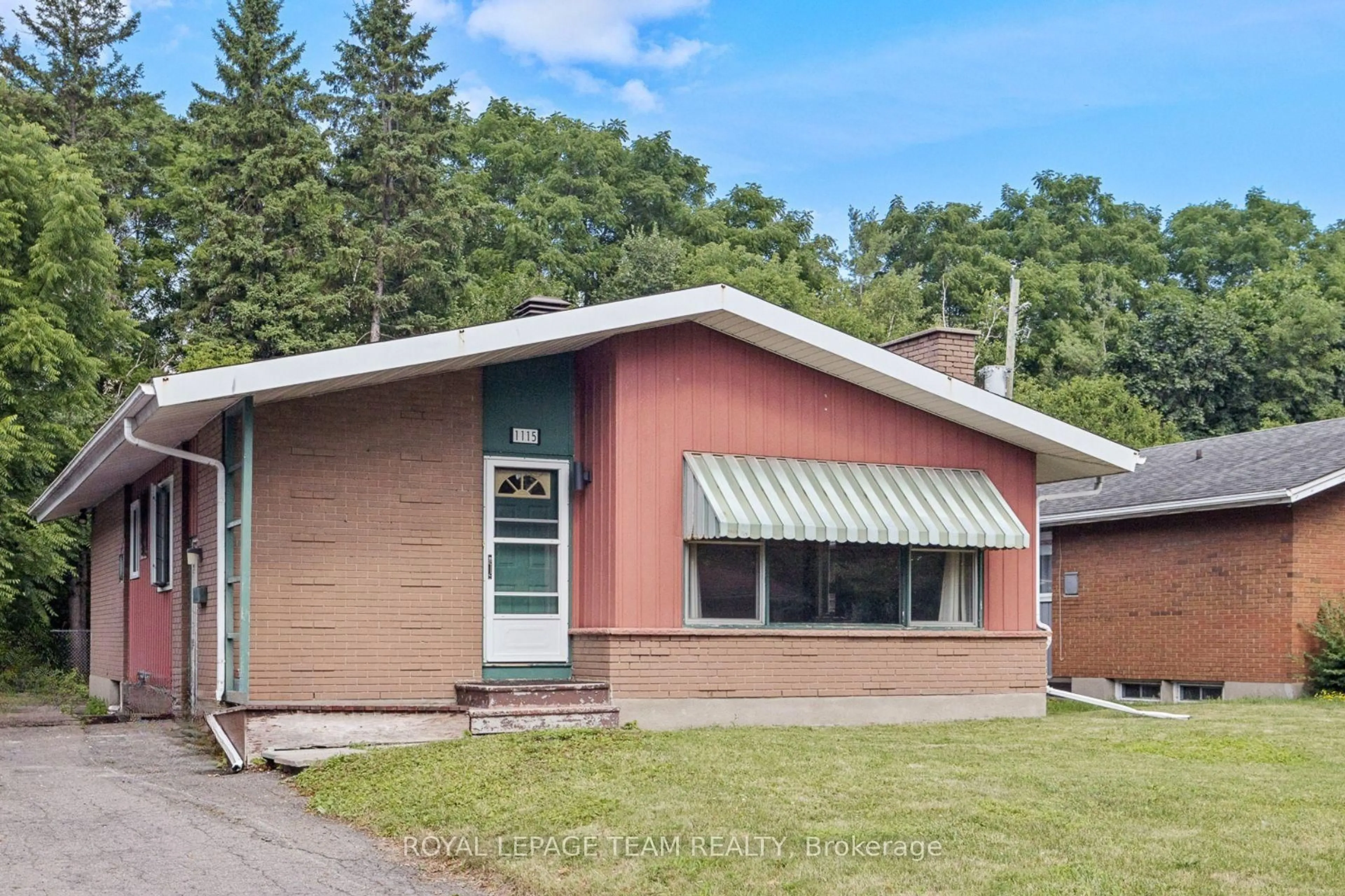 Home with brick exterior material, street for 1115 Parkway Dr, Ottawa Ontario K2C 2W1