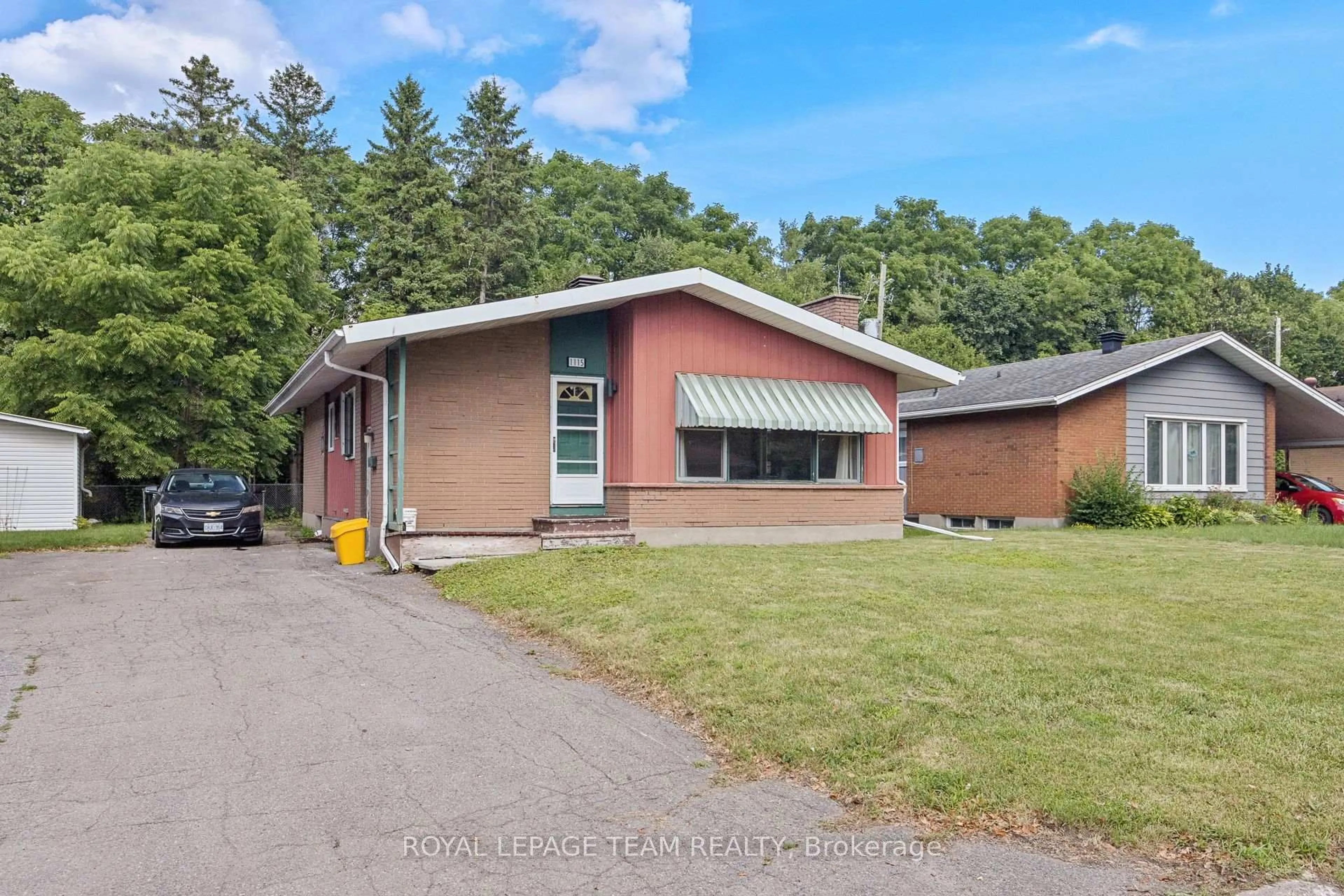 Home with brick exterior material, street for 1115 Parkway Dr, Ottawa Ontario K2C 2W1