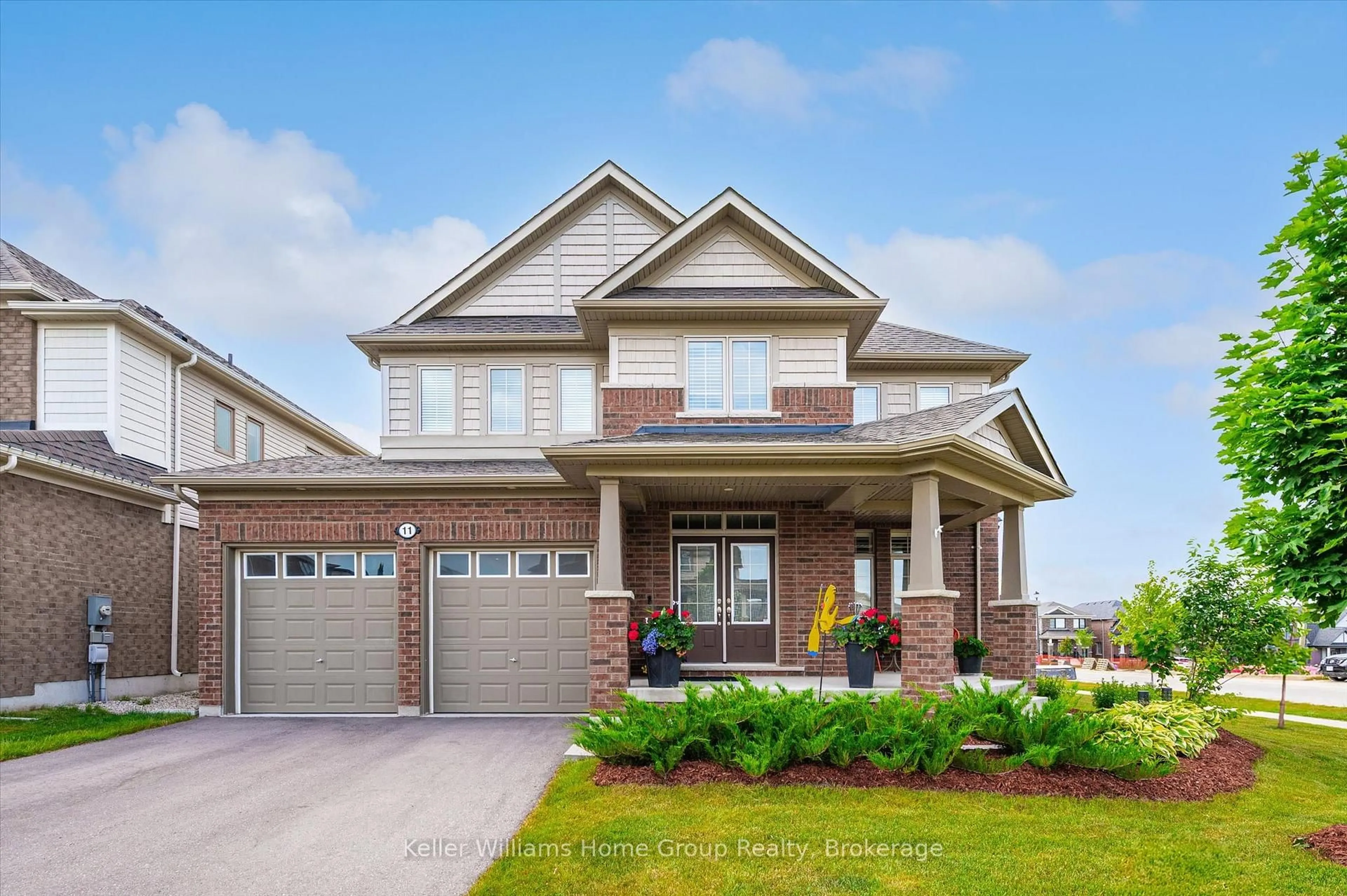 Home with brick exterior material, street for 11 Harpin Way, Centre Wellington Ontario N1M 0H2