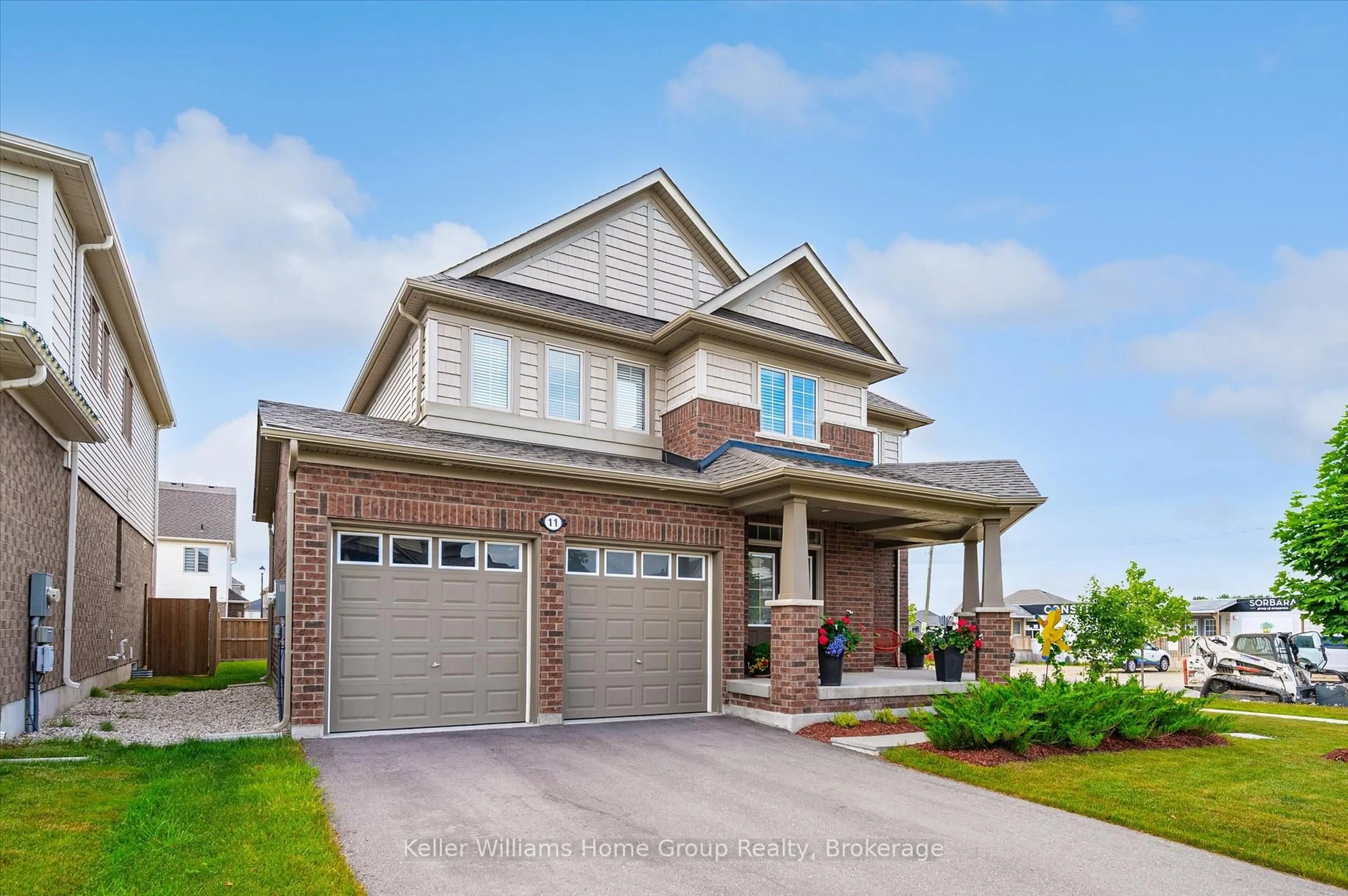 Home with brick exterior material, street for 11 Harpin Way, Centre Wellington Ontario N1M 0H2