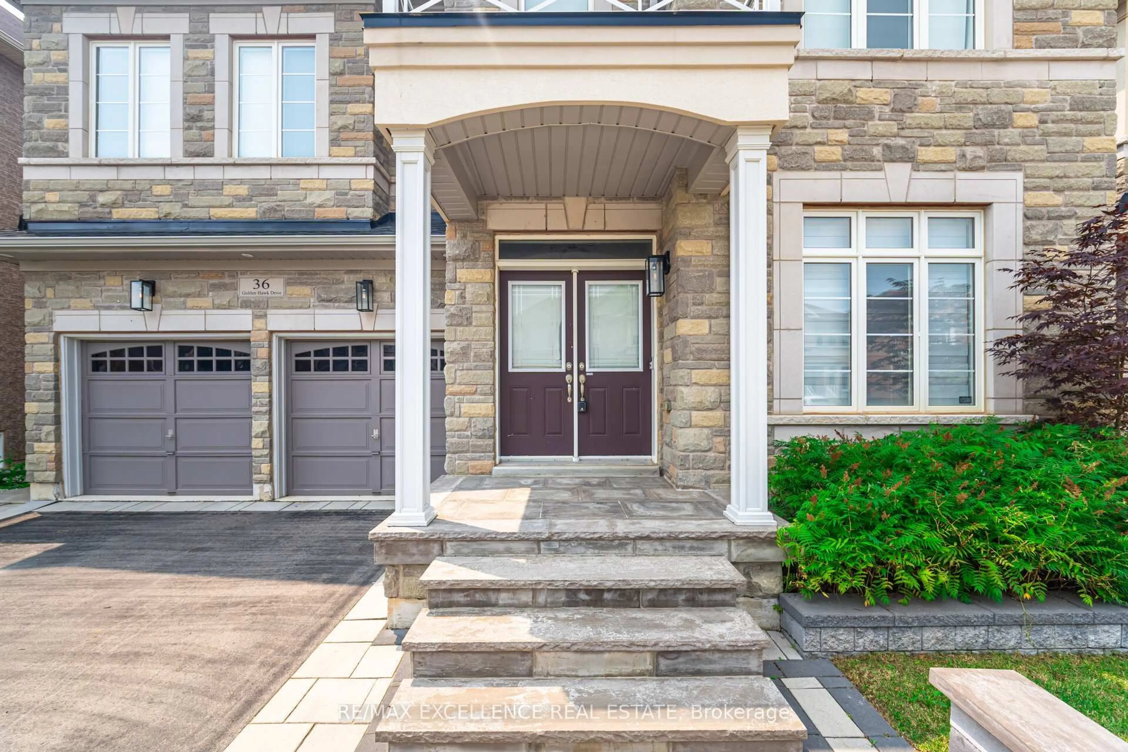 Home with brick exterior material, street for 36 Golden Hawk Dr, Hamilton Ontario L8B 1W8