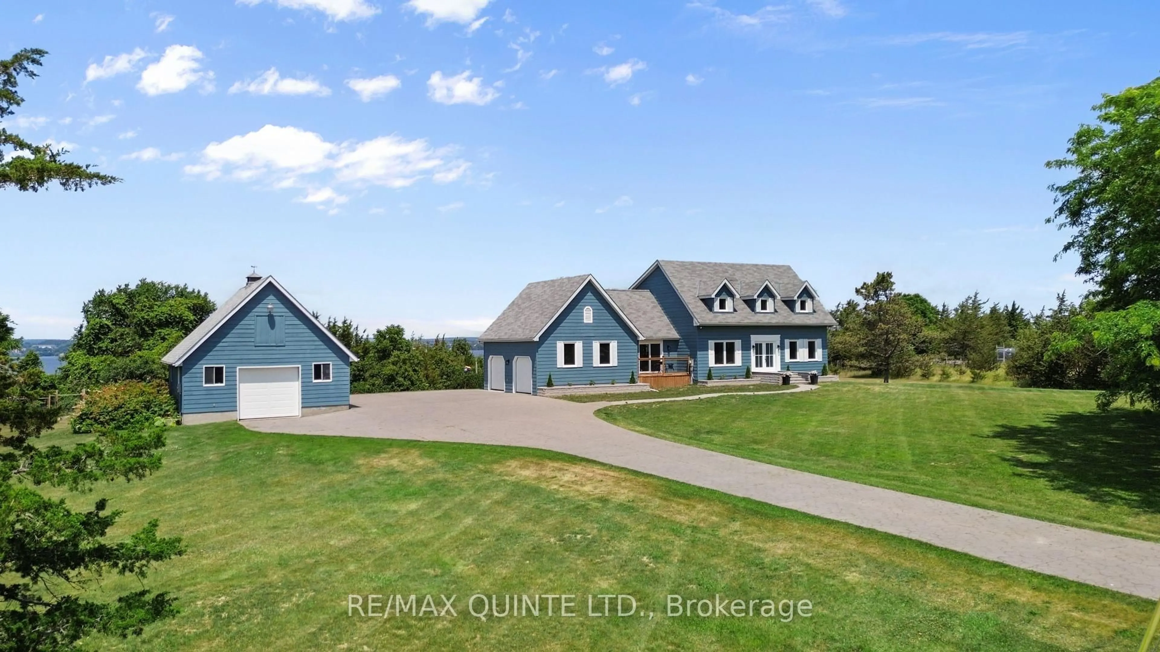 A pic from outside/outdoor area/front of a property/back of a property/a pic from drone, unknown for 3130 County Rd 3, Prince Edward County Ontario K0K 1L0